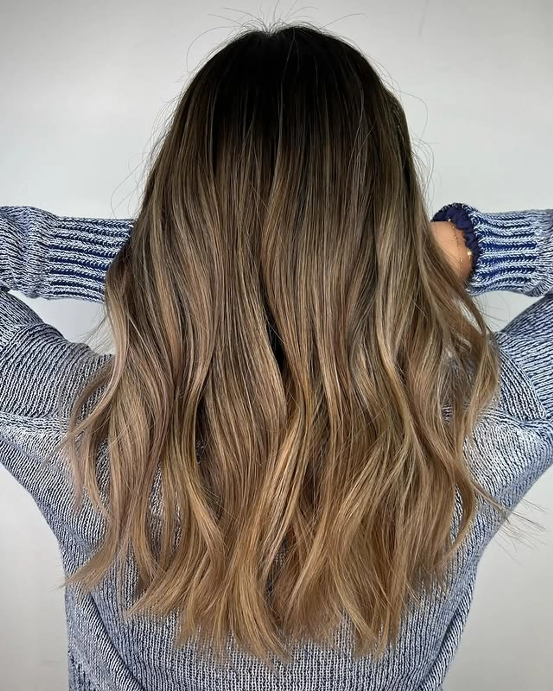 Long wavy hair with a seamless caramel ombre. 1