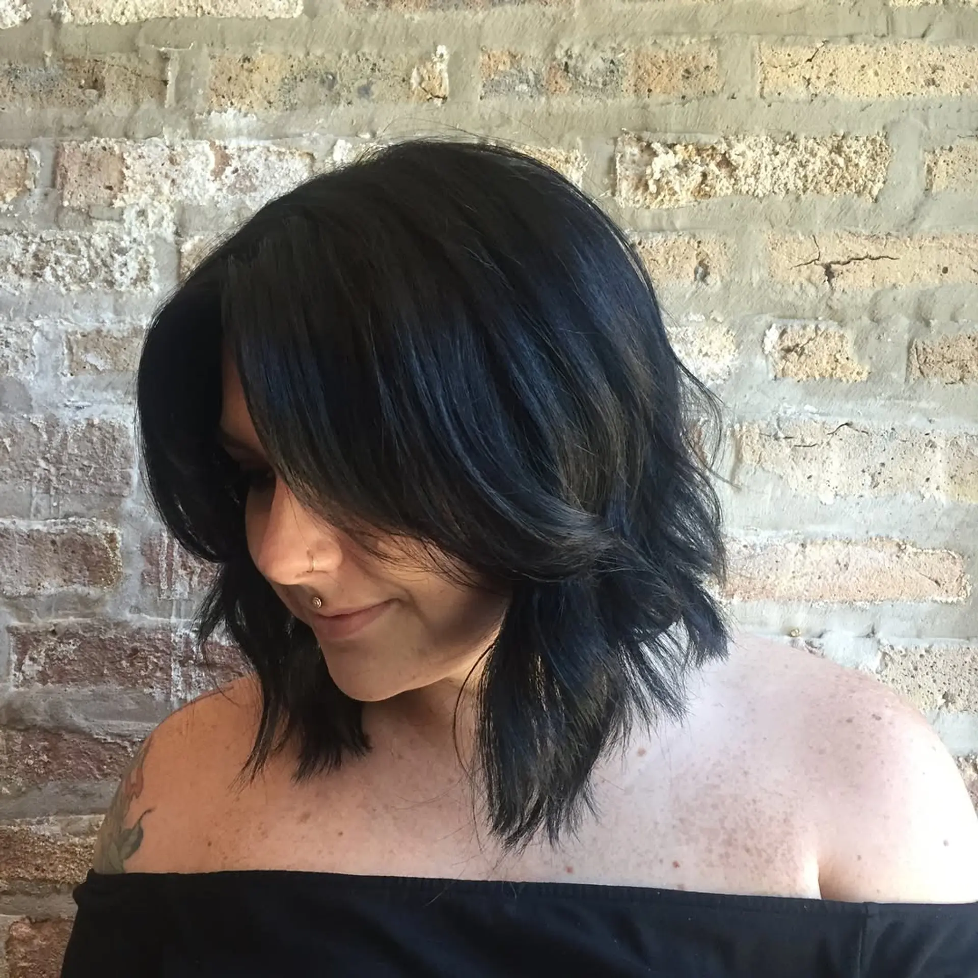 A striking ombre lob with a smooth transition from dark roots to vibrant teal ends. 3