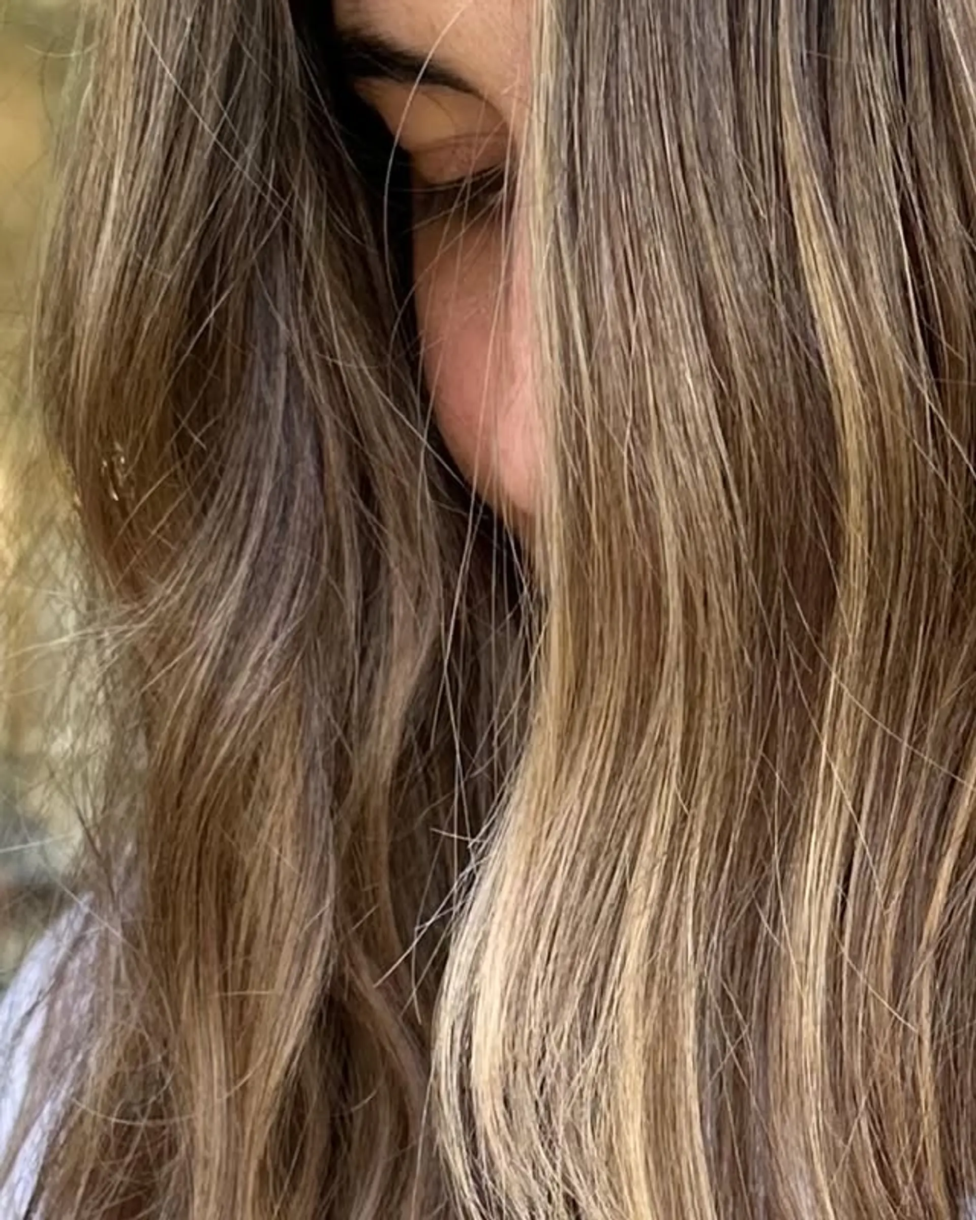 Long, wavy hairstyle featuring a bronde balayage with subtle layers. 1