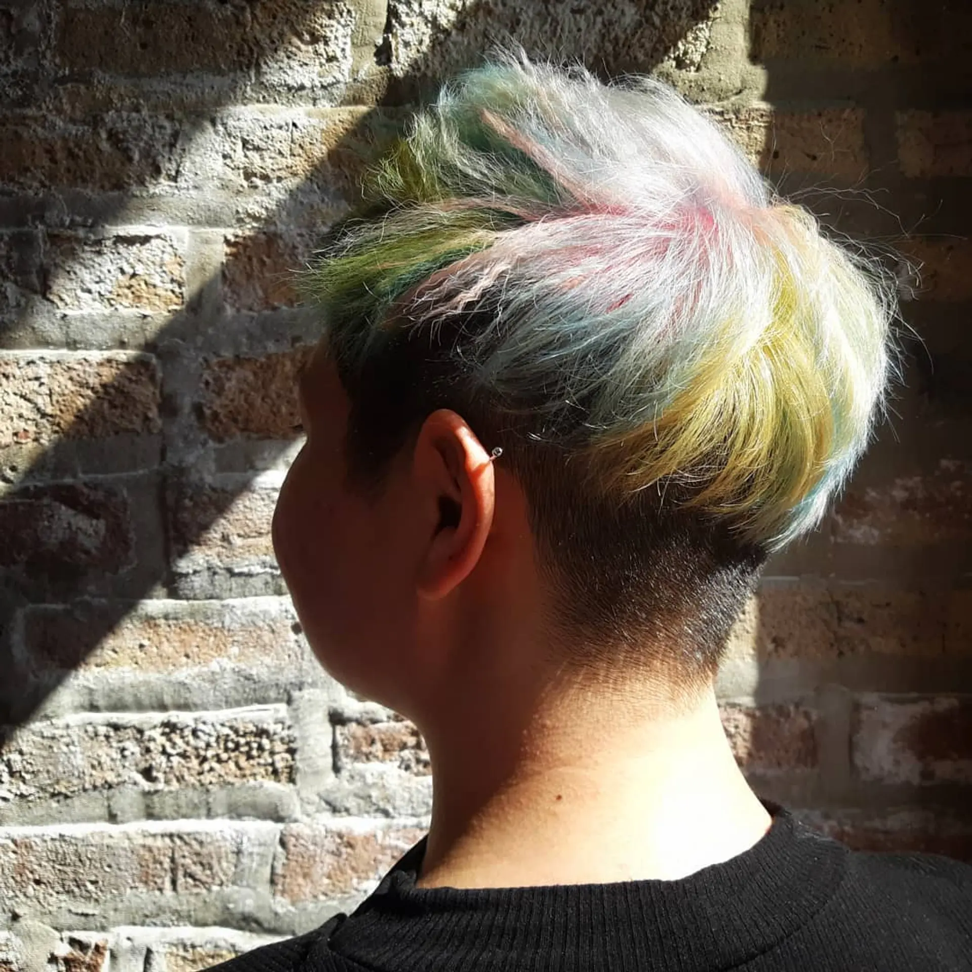 A short undercut with a mix of vibrant pastel highlights. 2