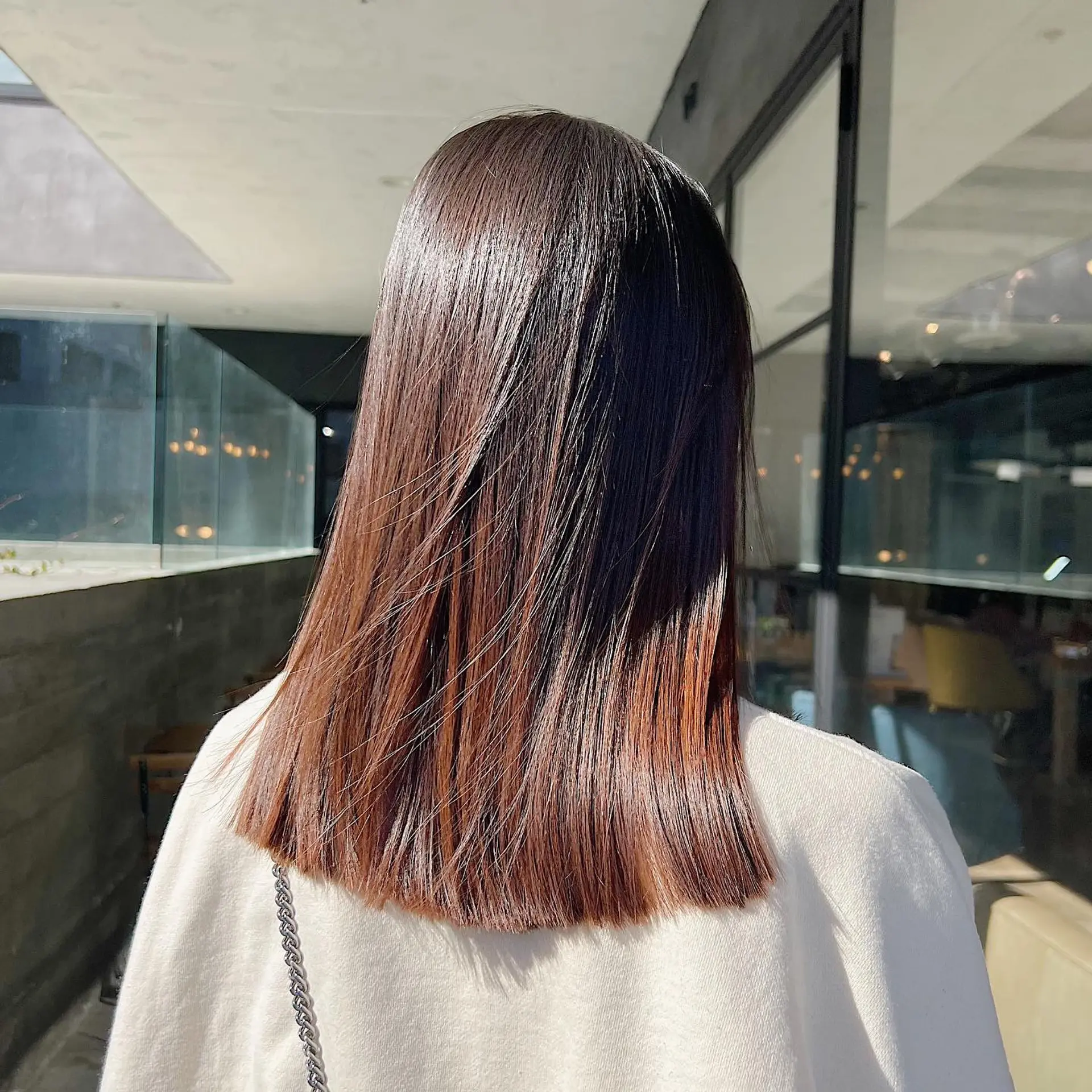 A sleek and modern lob with a stunning copper ombre effect. 2