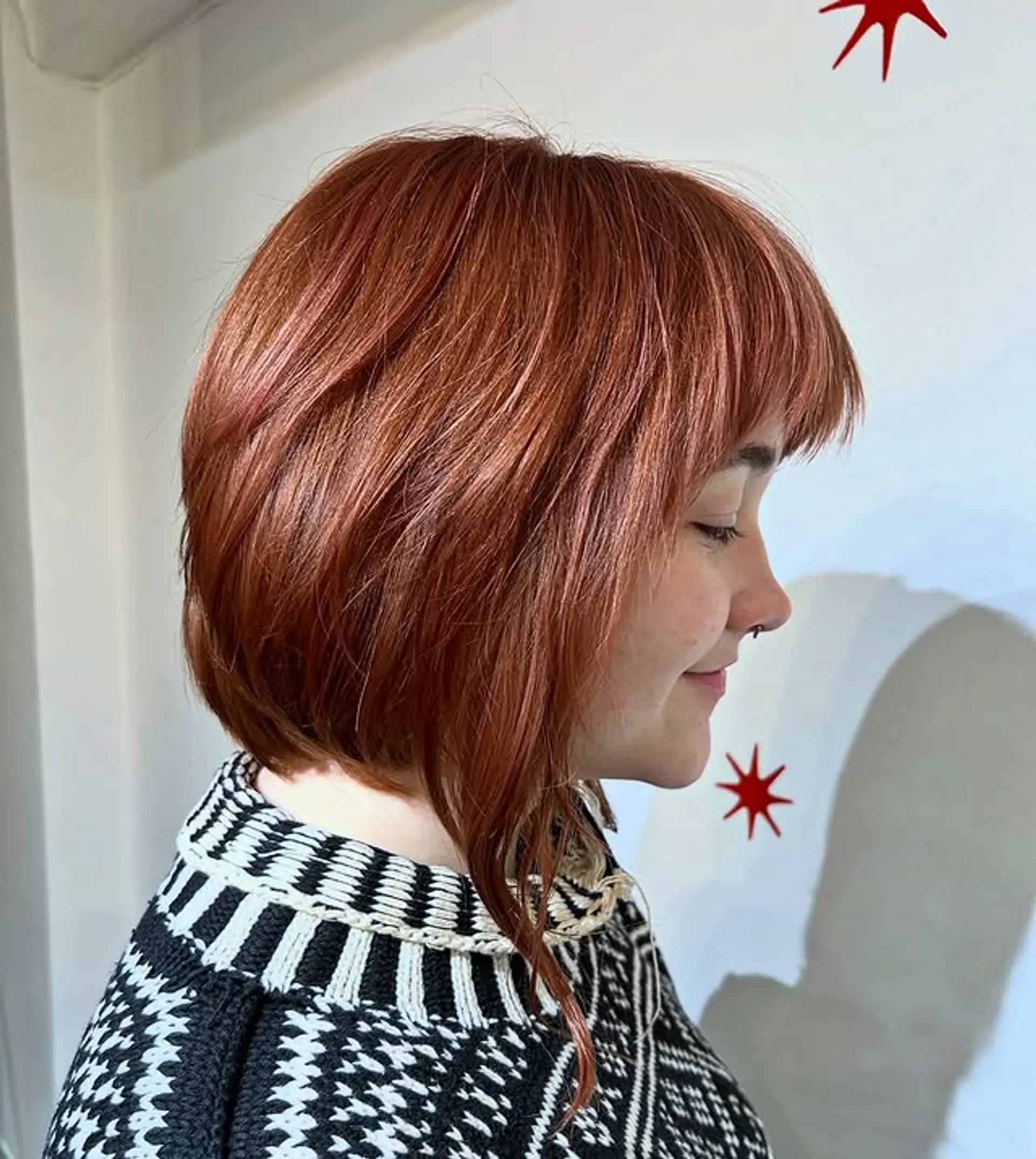 A shaggy, layered bob with bangs, providing texture and movement. 1