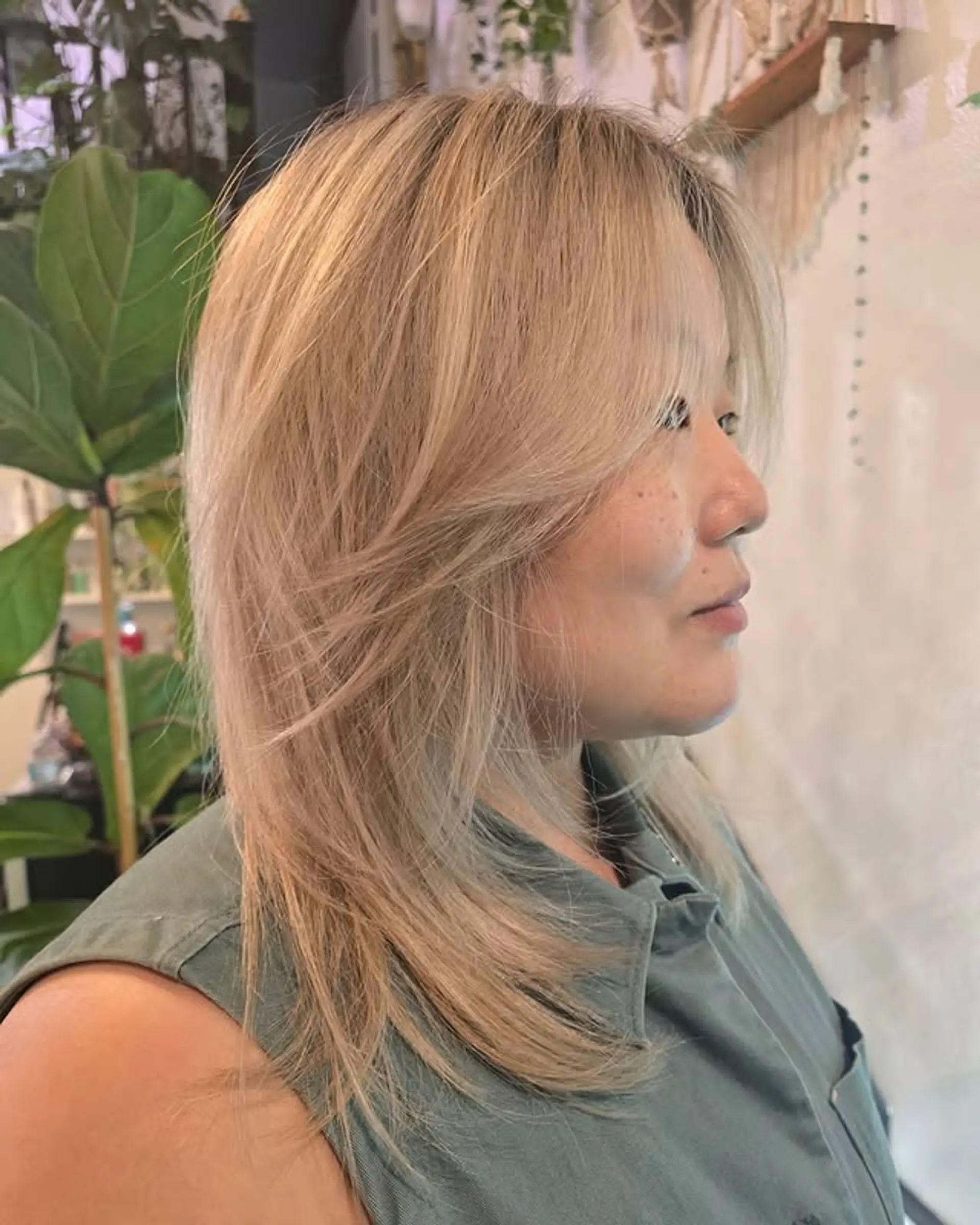 A layered cut with face-framing layers and curtain bangs. 1