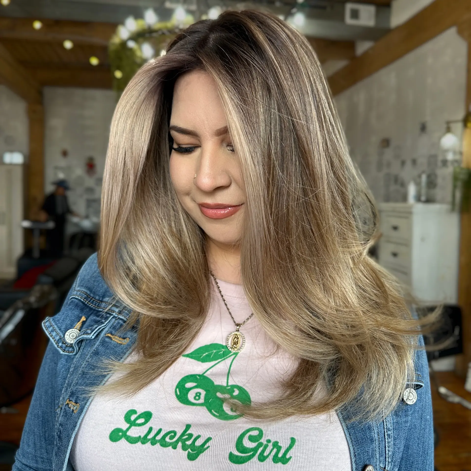 This is a layered medium-length hairstyle with bronde coloring that is perfectly styled. 1