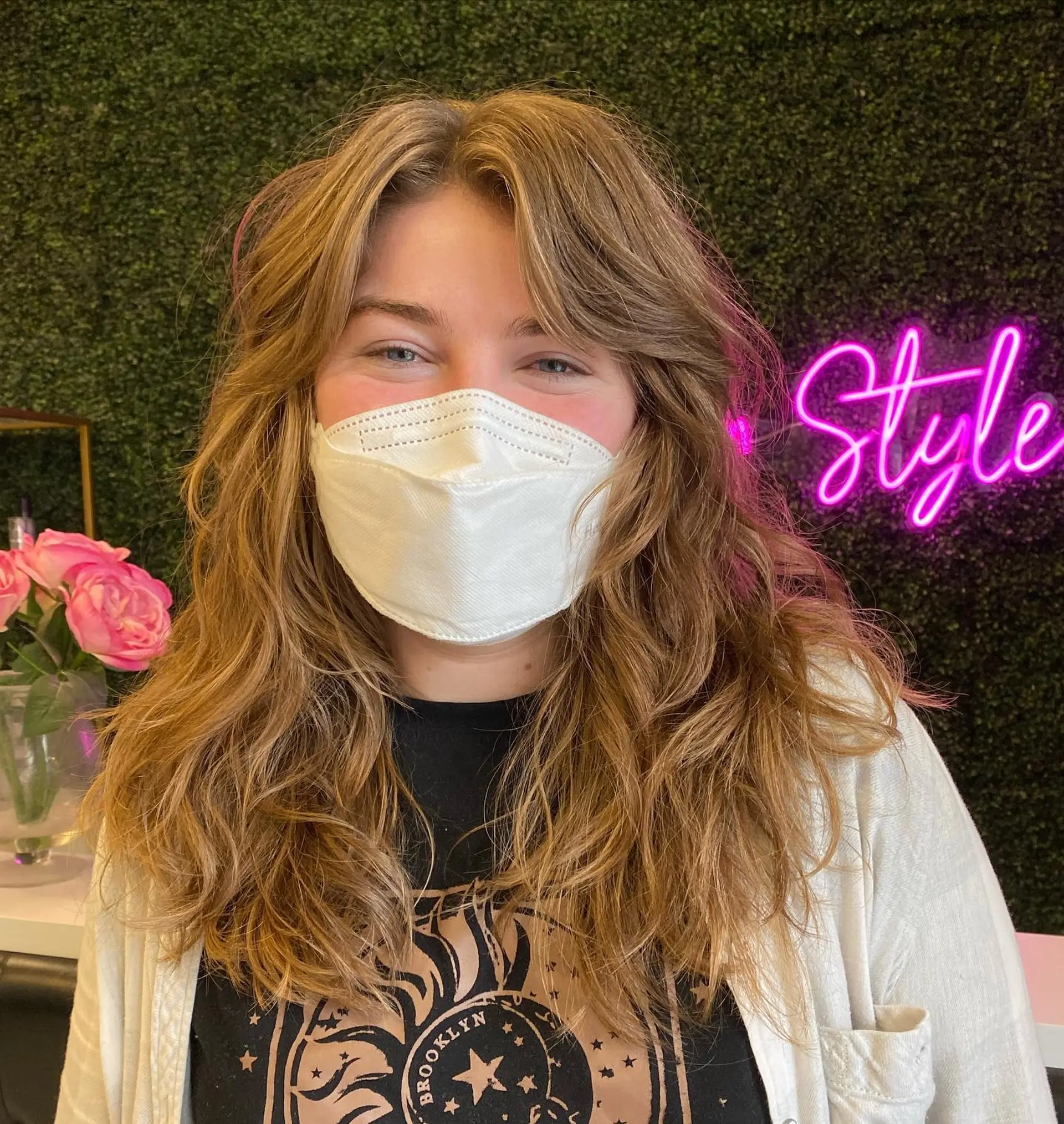 A long, layered shag haircut with face-framing curtain bangs and a wavy texture. 1