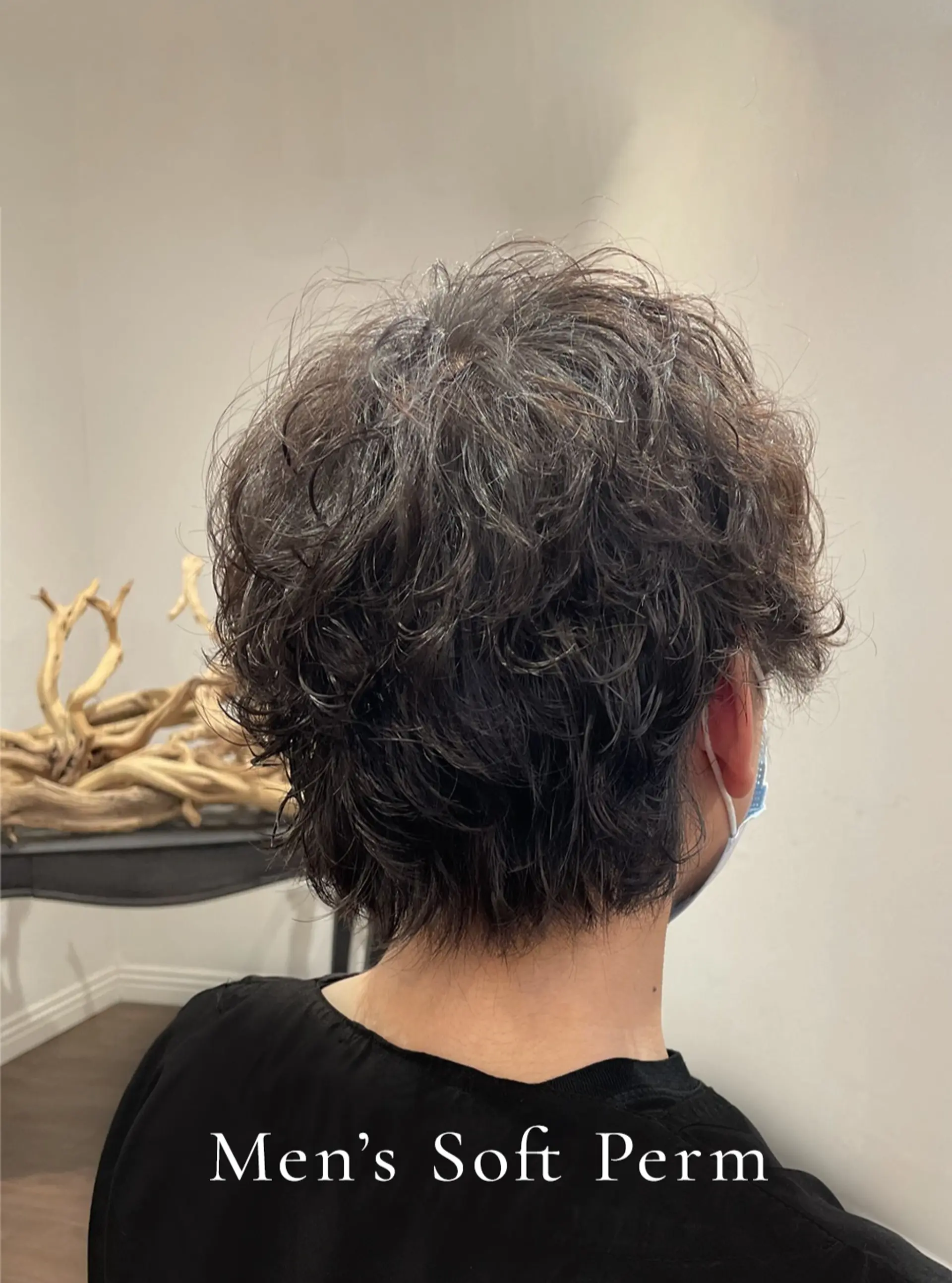 A textured short haircut enhanced with a soft perm for effortless volume and loose, piecey waves. 1