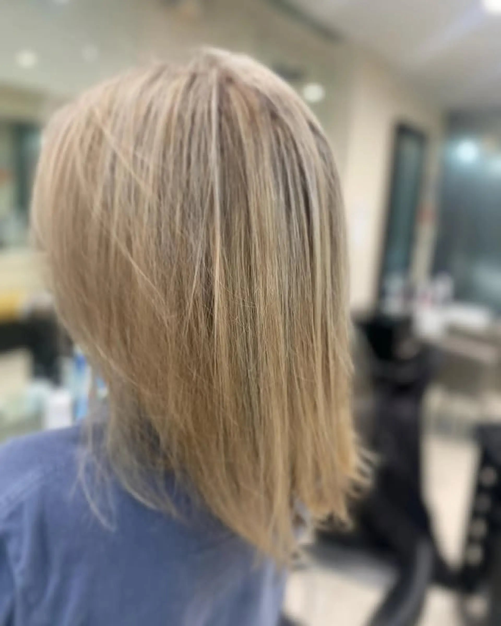 A trendy, layered lob with subtle face-framing layers. 1