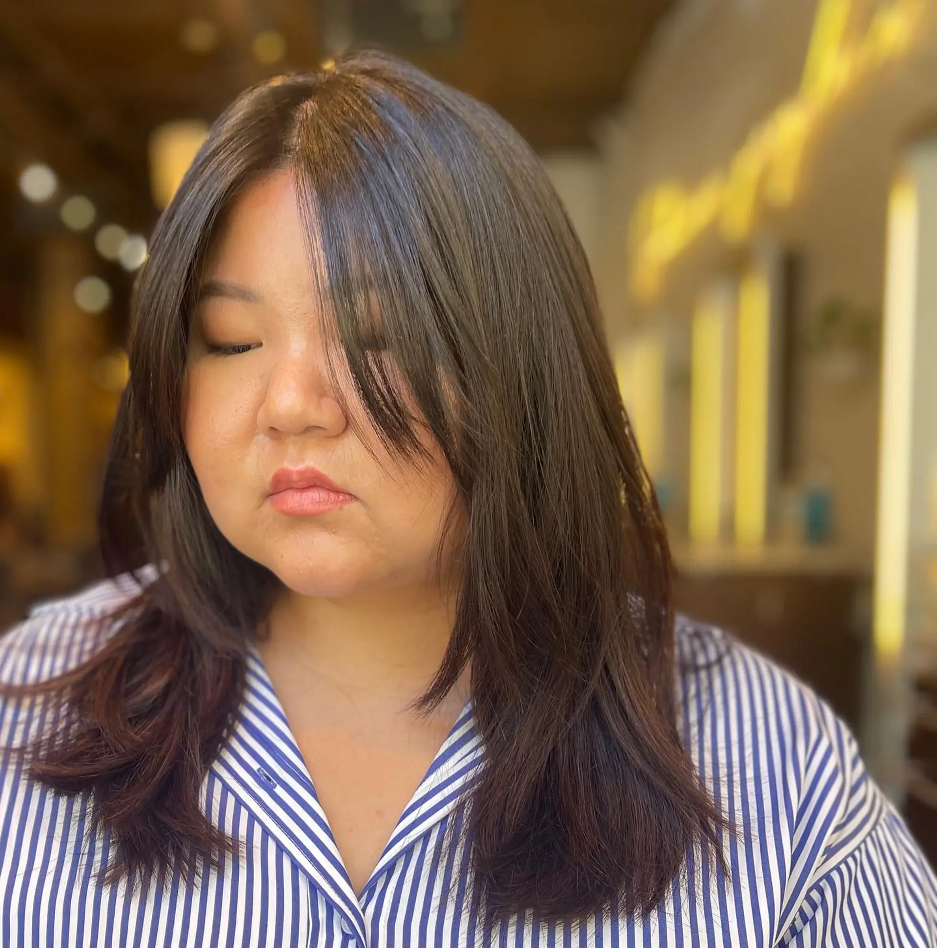 A trendy wolf cut hairstyle featuring face-framing layers. 1