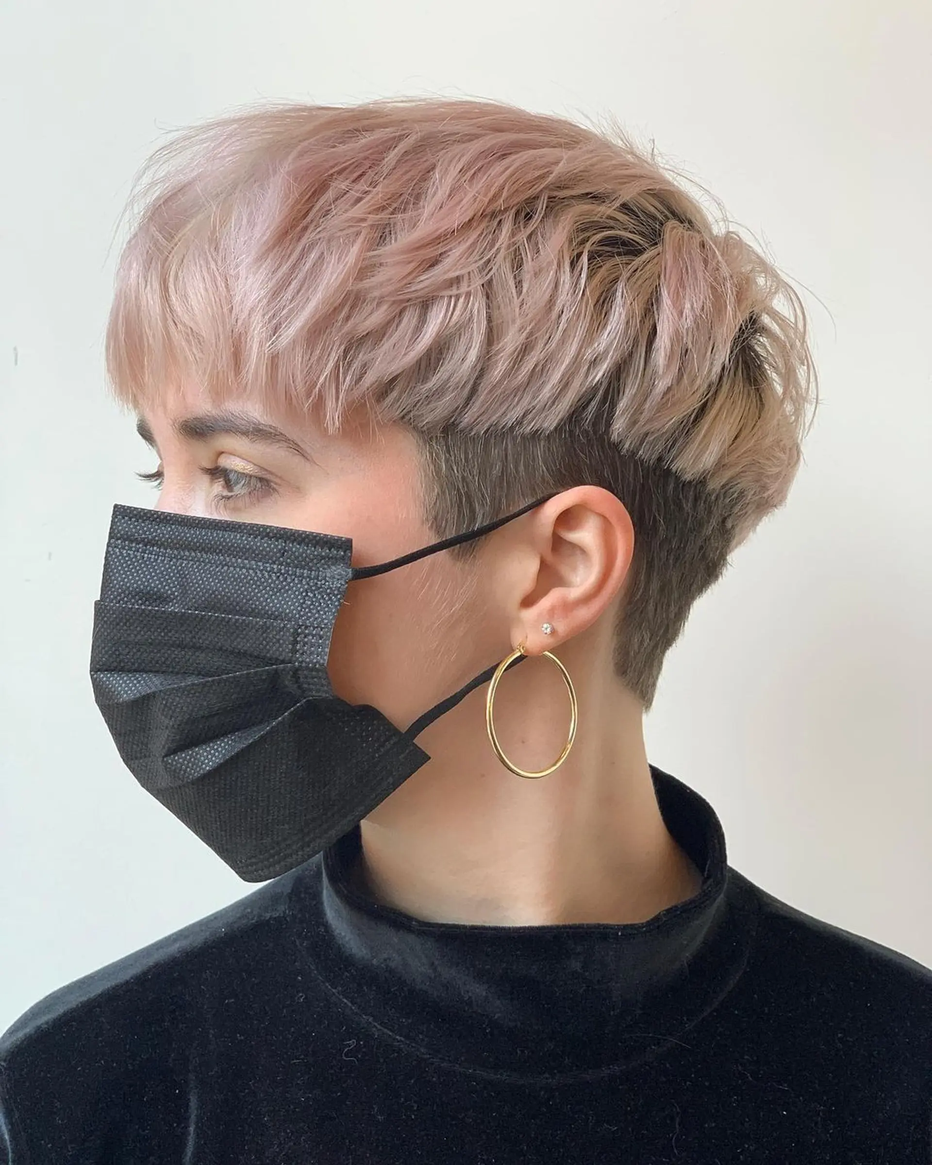 A chic lavender pixie with a textured fringe, pastel tones, and short layers, offering an edgy yet soft aesthetic. 1