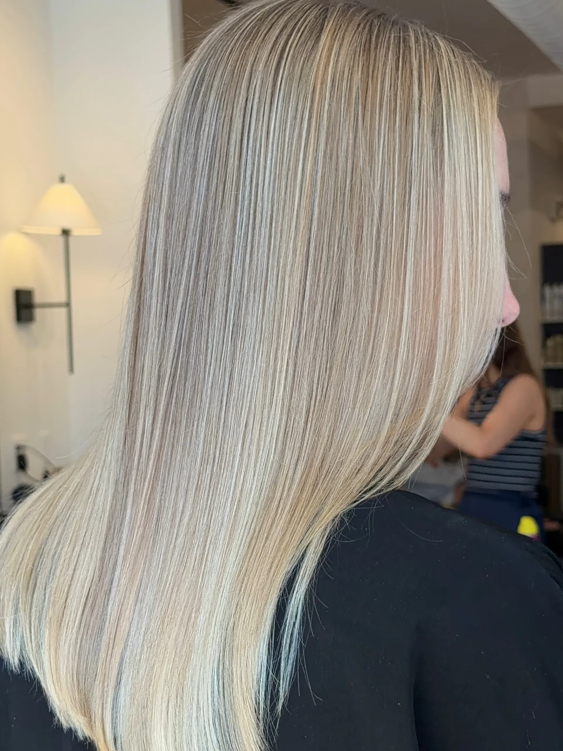 Straight, silky long hair featuring finely blended cool blonde highlights with soft dimension throughout. 1