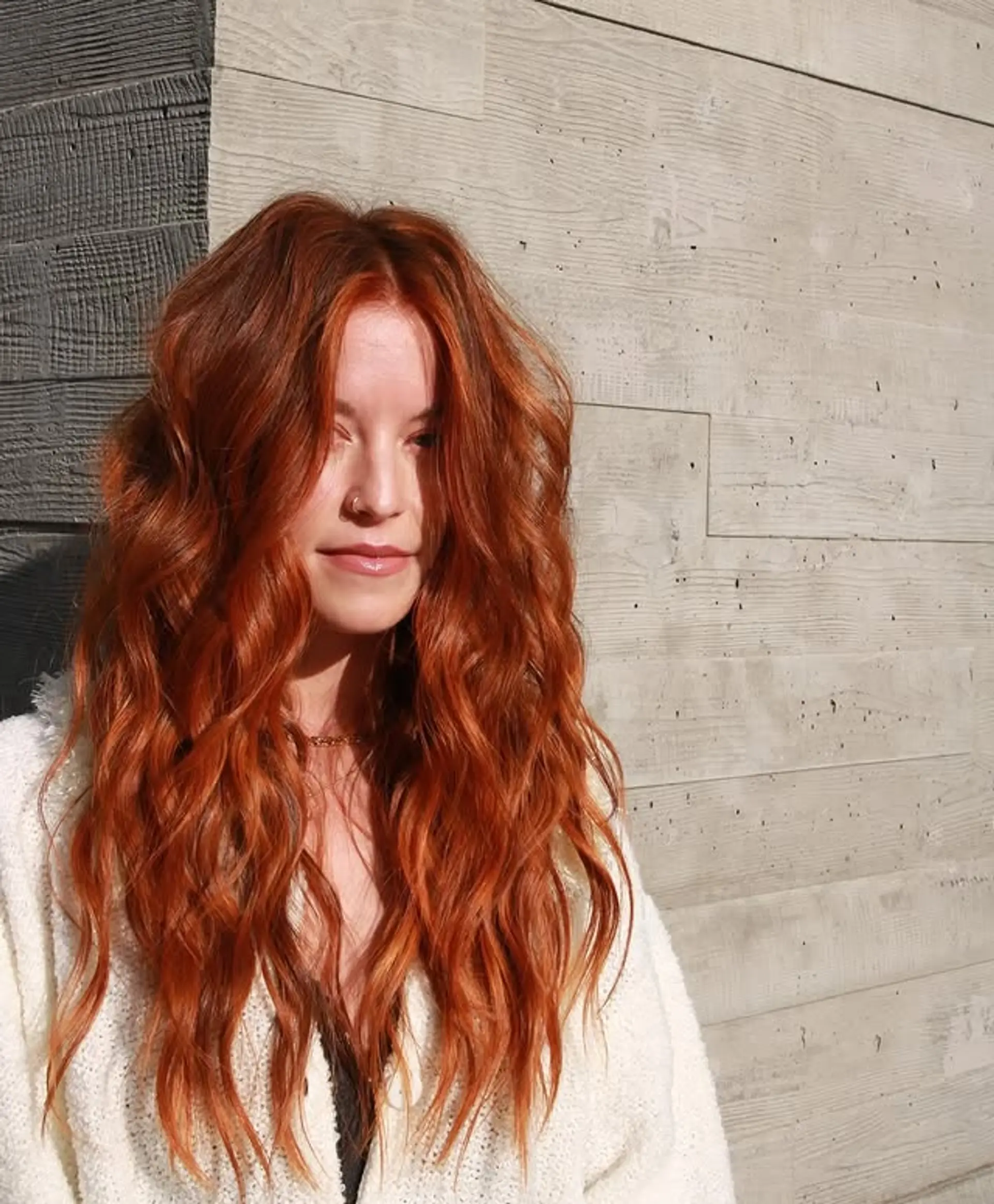 Long, wavy hairstyle with layered face framing. 1