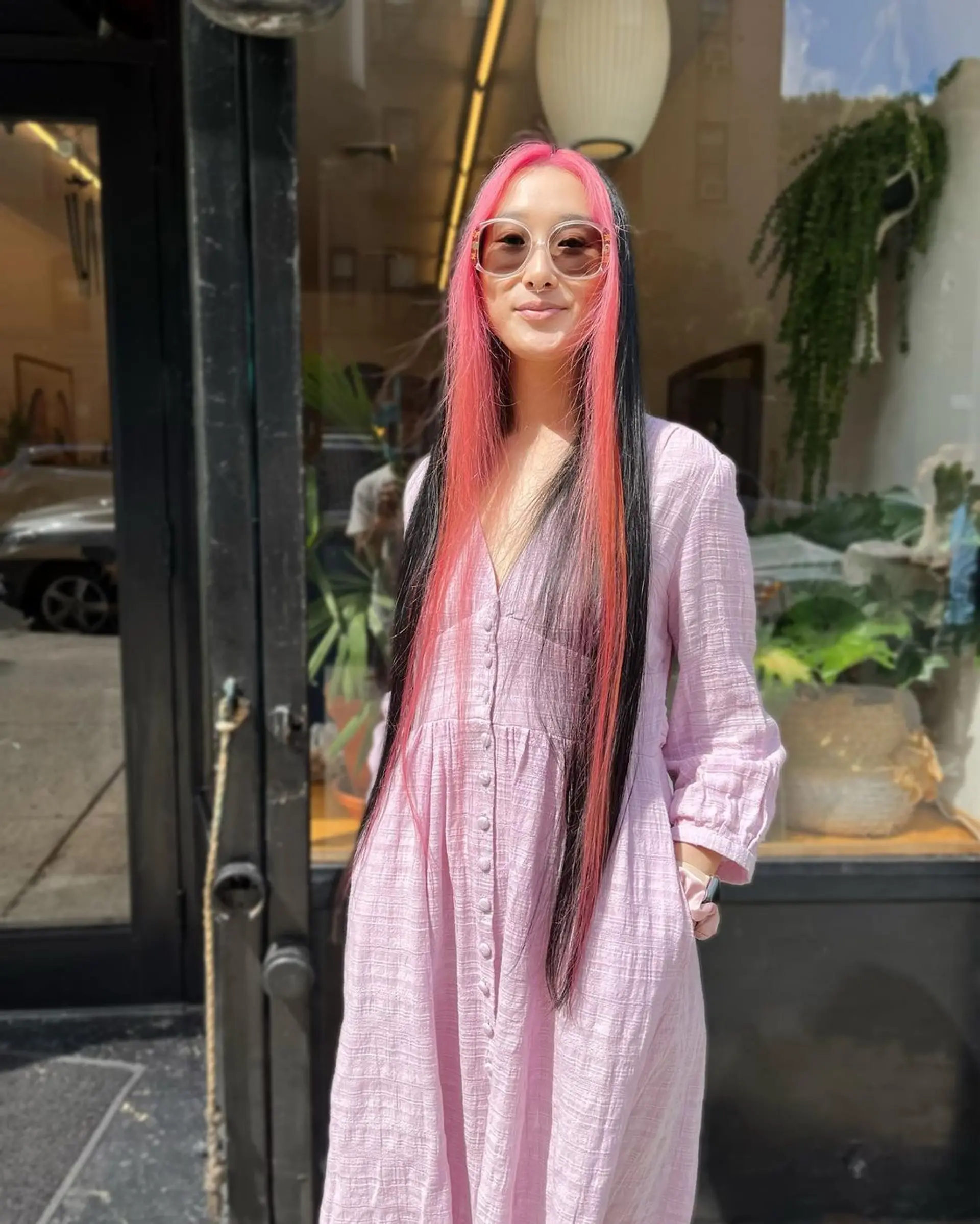 Very long, straight hair with vivid pink and black hues, center-parted with bright pink highlights against a black base, creating a bold and vibrant look. 1