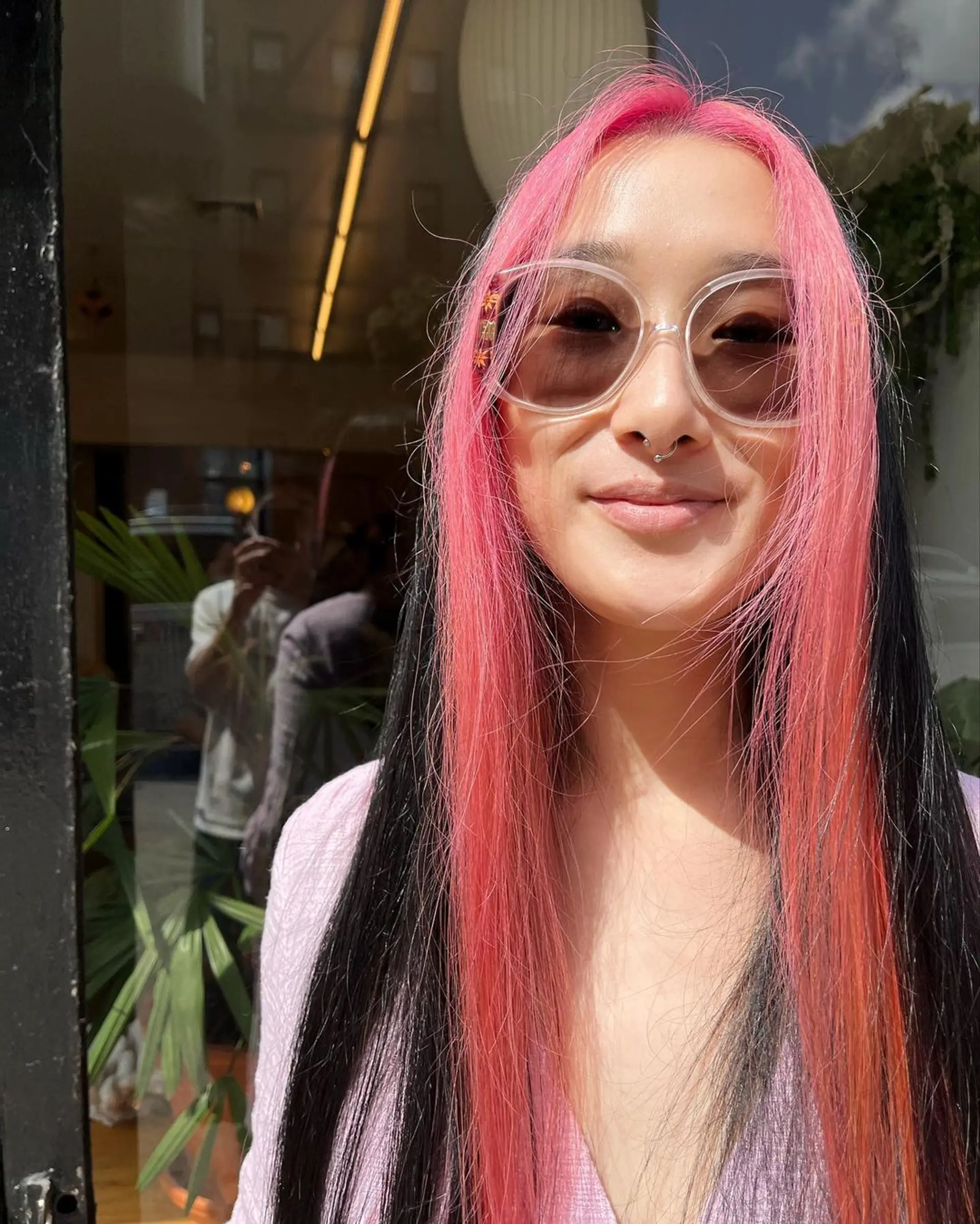 Very long, straight hair with vivid pink and black hues, center-parted with bright pink highlights against a black base, creating a bold and vibrant look. 2