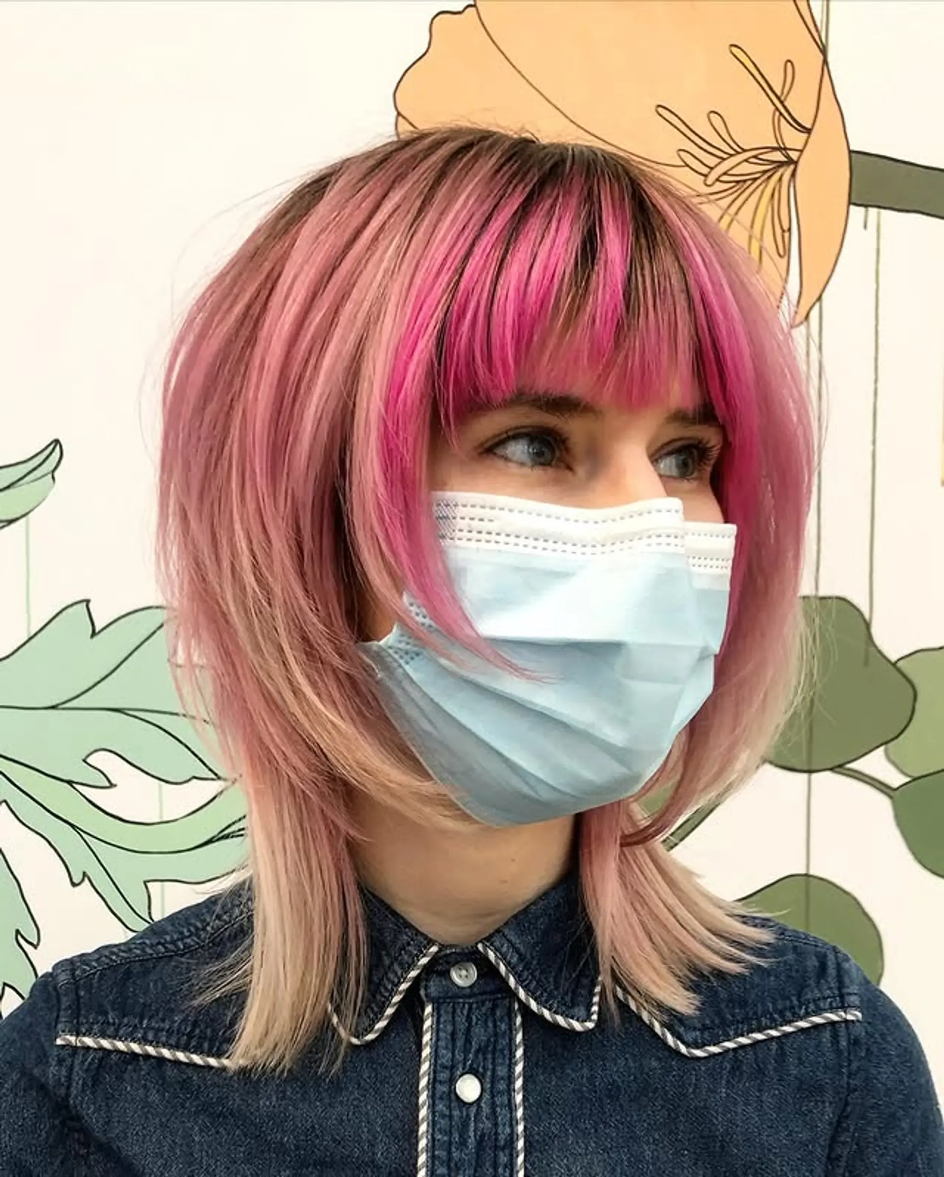 A modern shag haircut with layered texture and vibrant pink highlights. 1