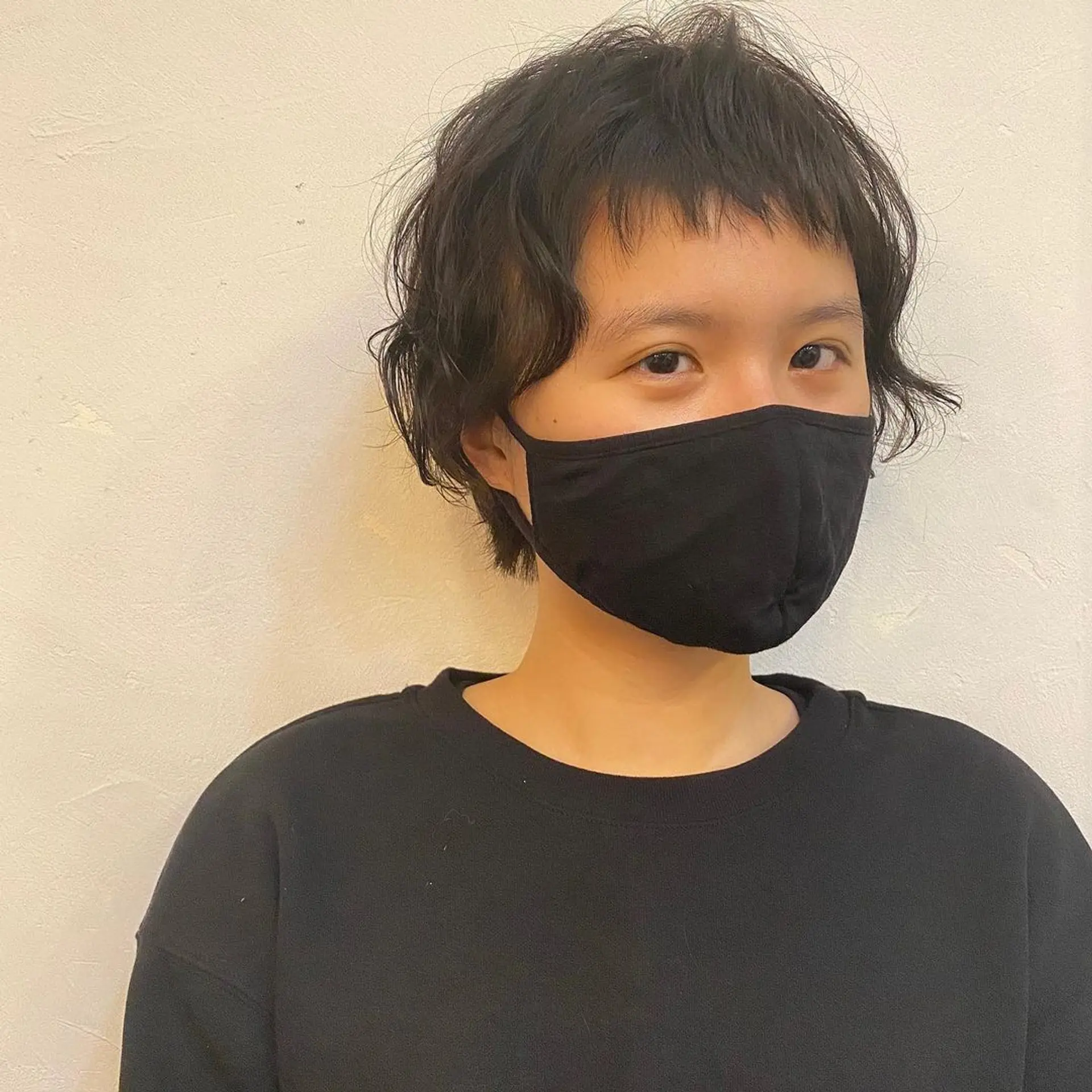 The hairstyle features a tousled pixie cut with a casual, carefree look. The texture is naturally wavy, adding volume and movement to the short length. (Hair by Coco) 1