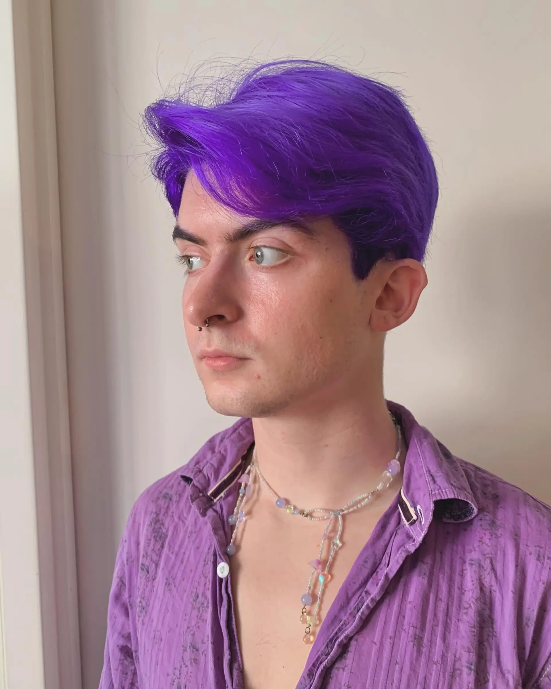 Vividly straight purple hair with a center part, short and playful, giving off an edgy and bold vibe, ideal for a trendy look. 3