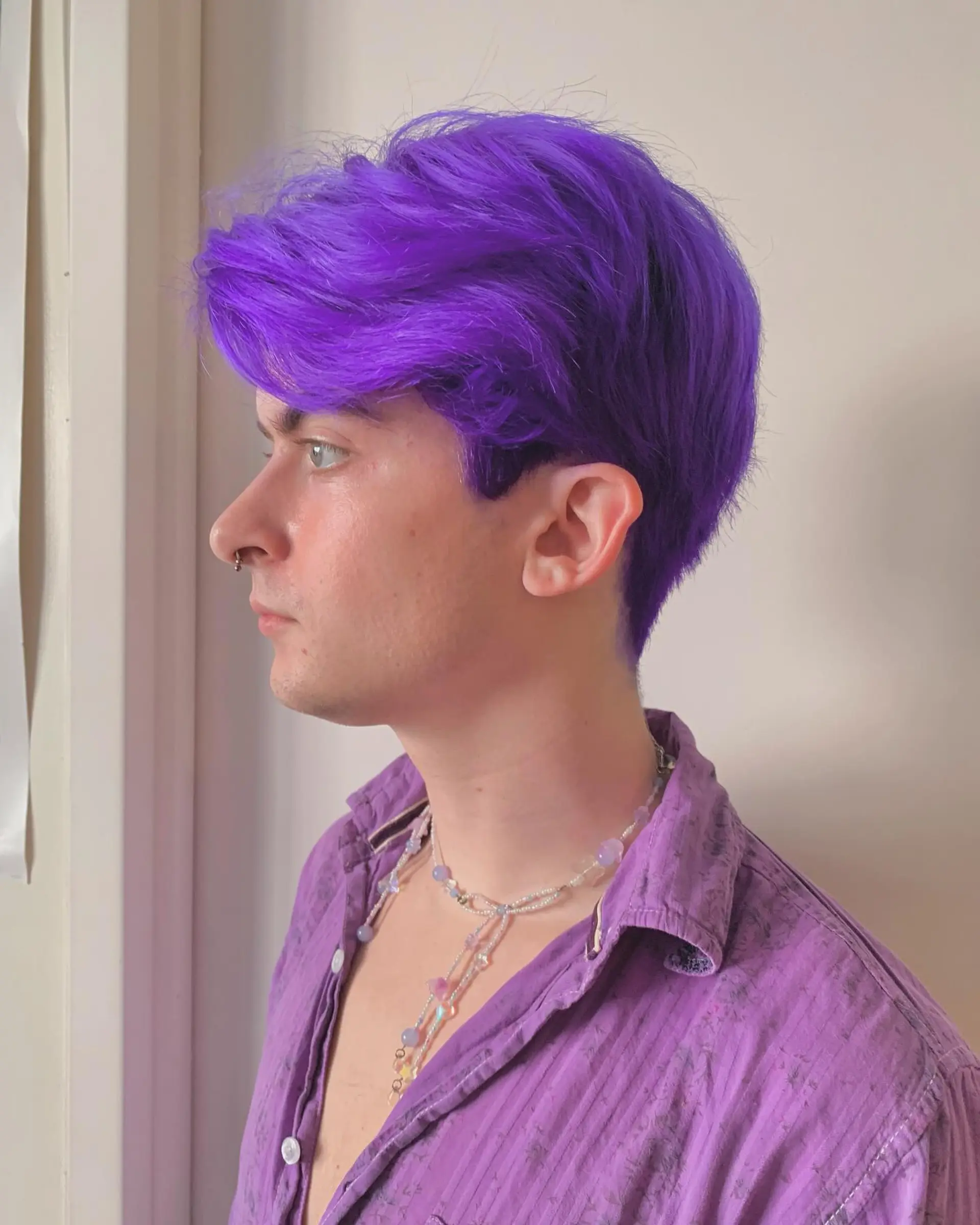 Vividly straight purple hair with a center part, short and playful, giving off an edgy and bold vibe, ideal for a trendy look. 5