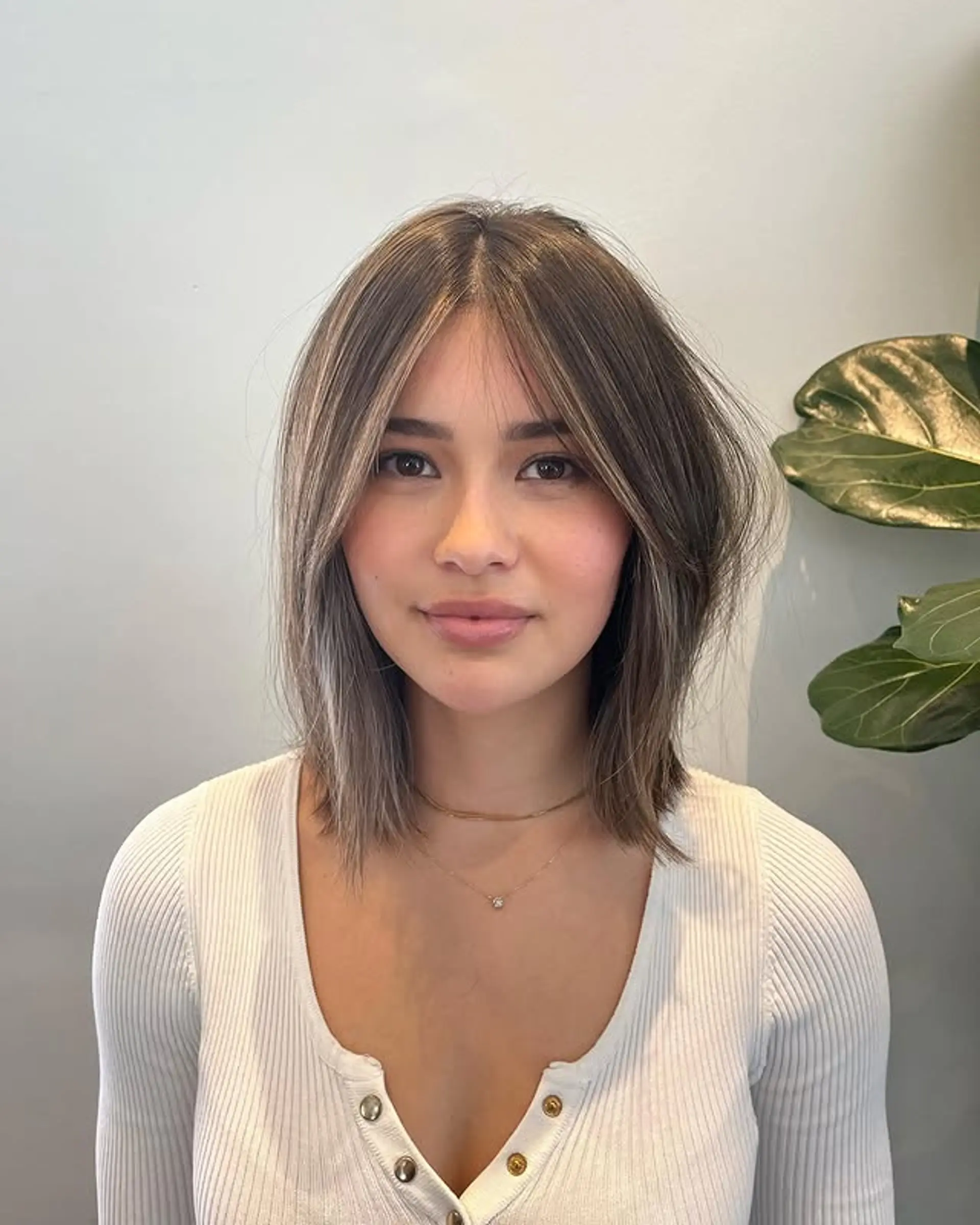 A modern shag haircut with face-framing layers and textured ends. 1