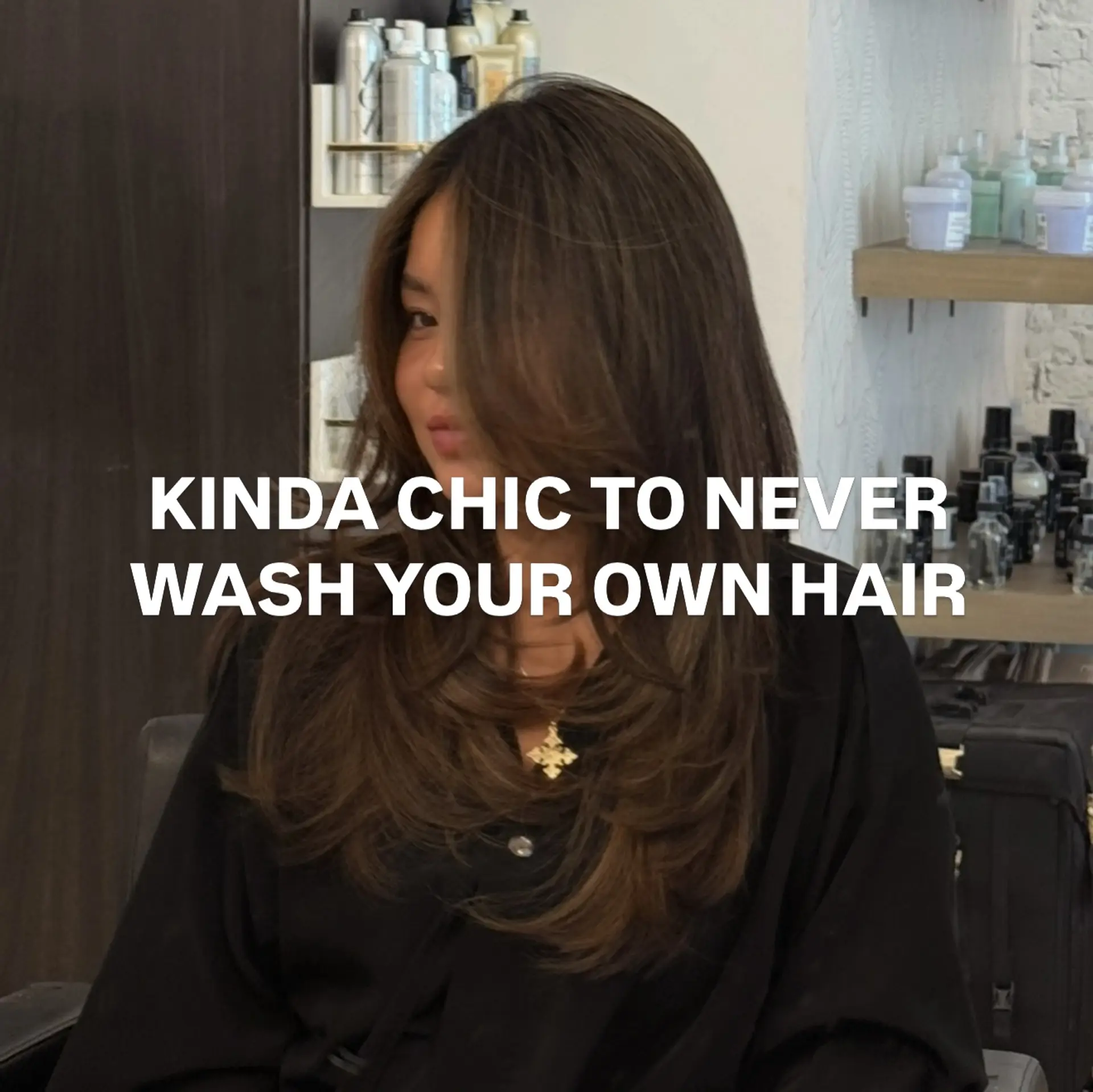 A voluminous blowout featuring feathered face-framing layers and inward-curved ends. 1