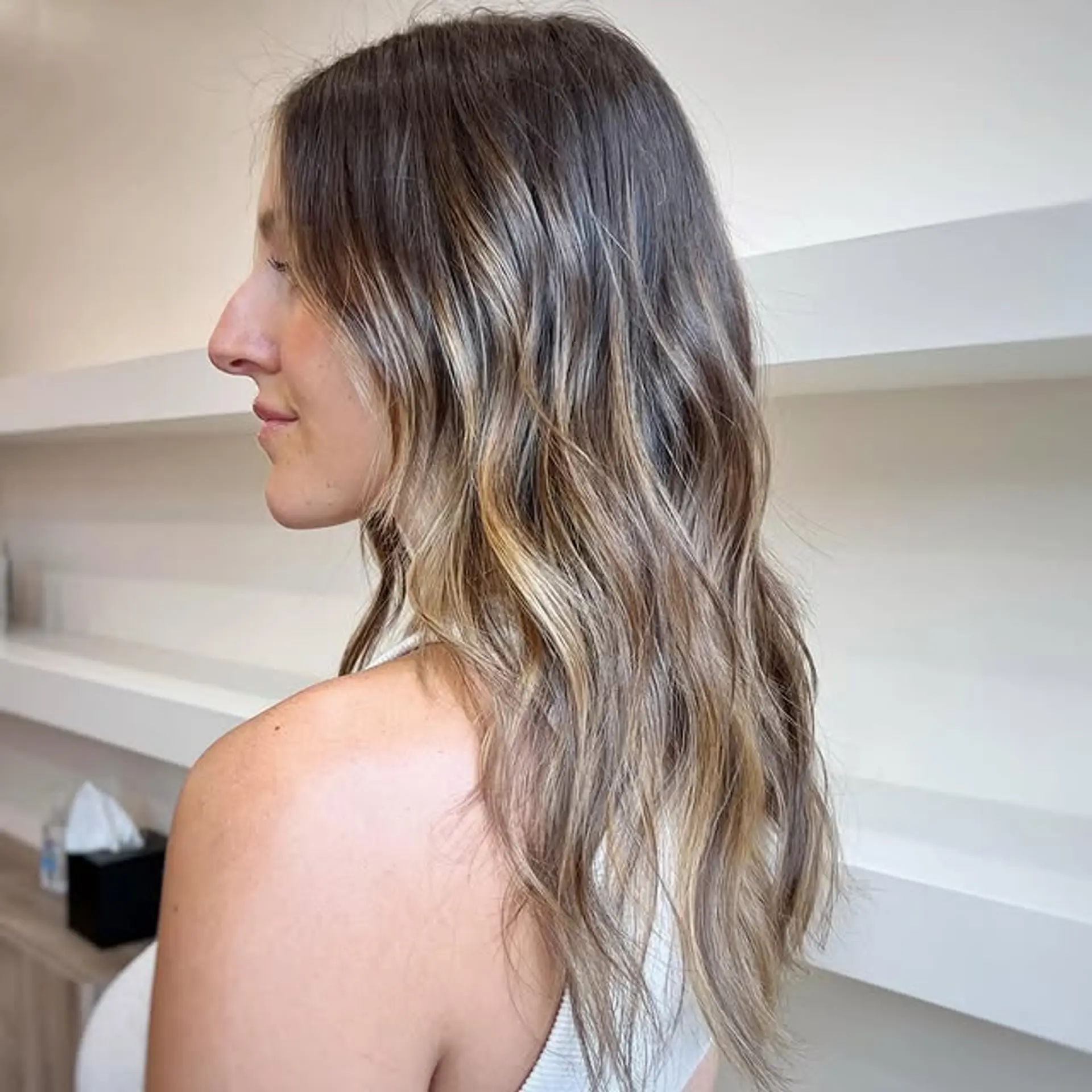 Long wavy hair with a caramel swirl balayage. 1