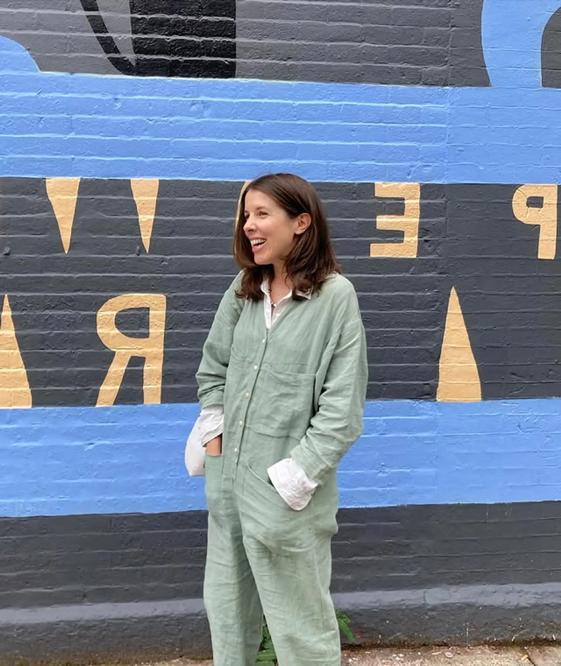 A medium-length wavy hairstyle with soft layers and face-framing highlights. 1