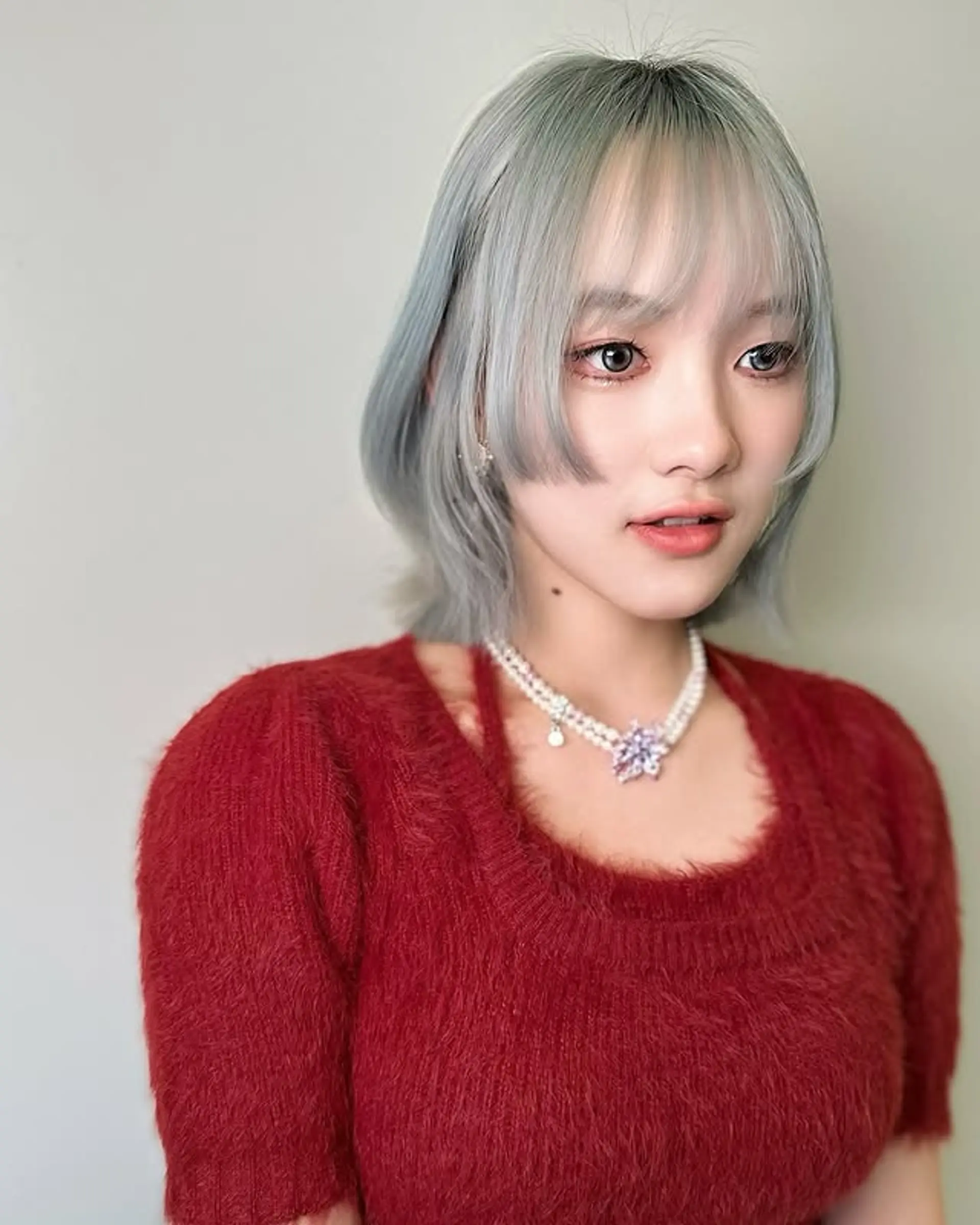 A blunt bob with short, choppy bangs. 1