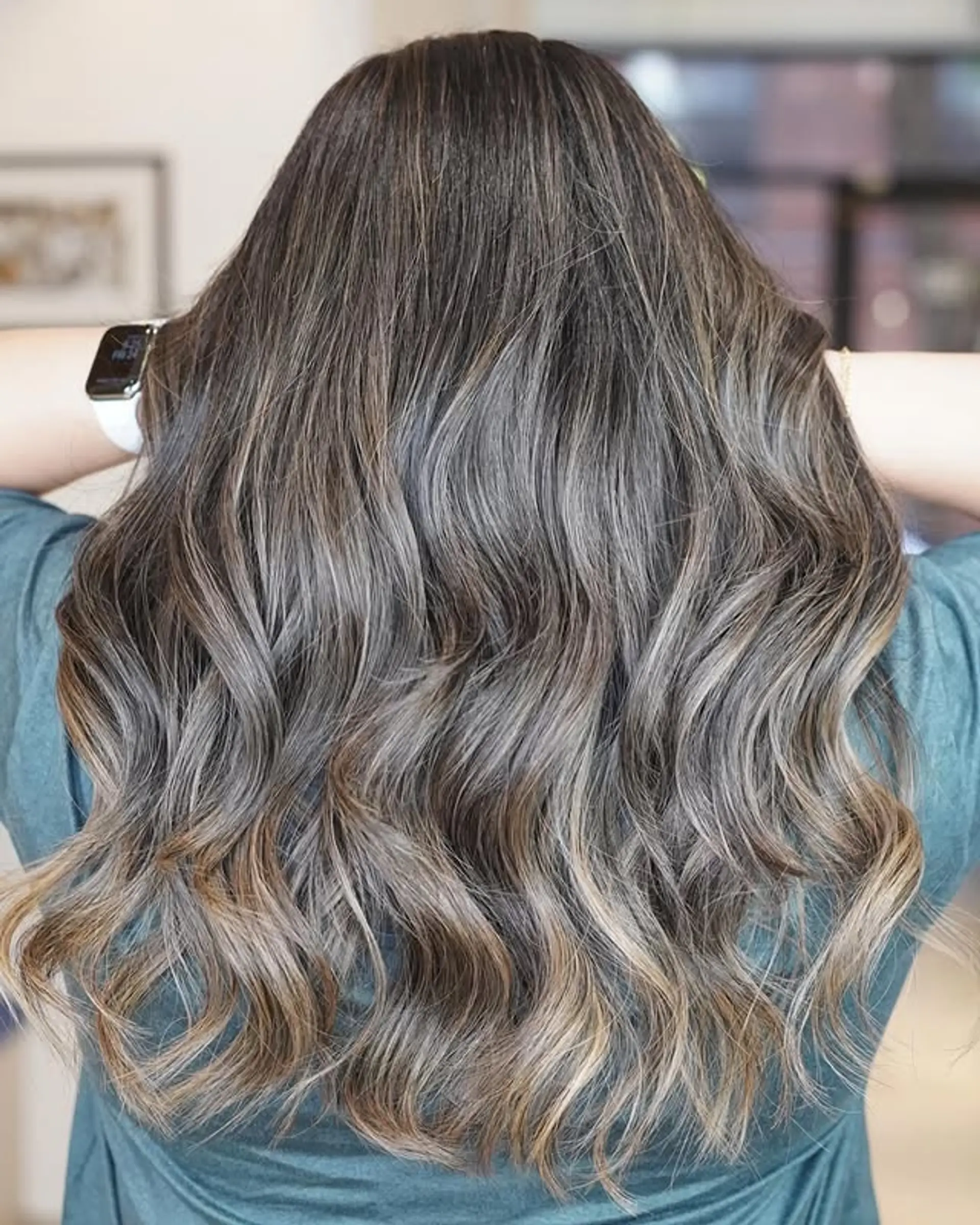 Long, wavy hair with a seamless ash blonde balayage and silver highlights. 1