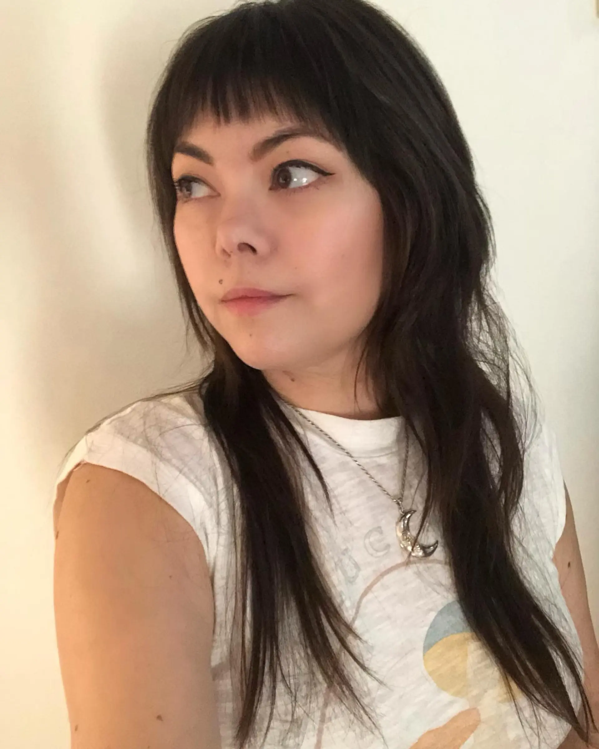 A textured layered shag cut with soft face-framing pieces and choppy micro bangs. 1