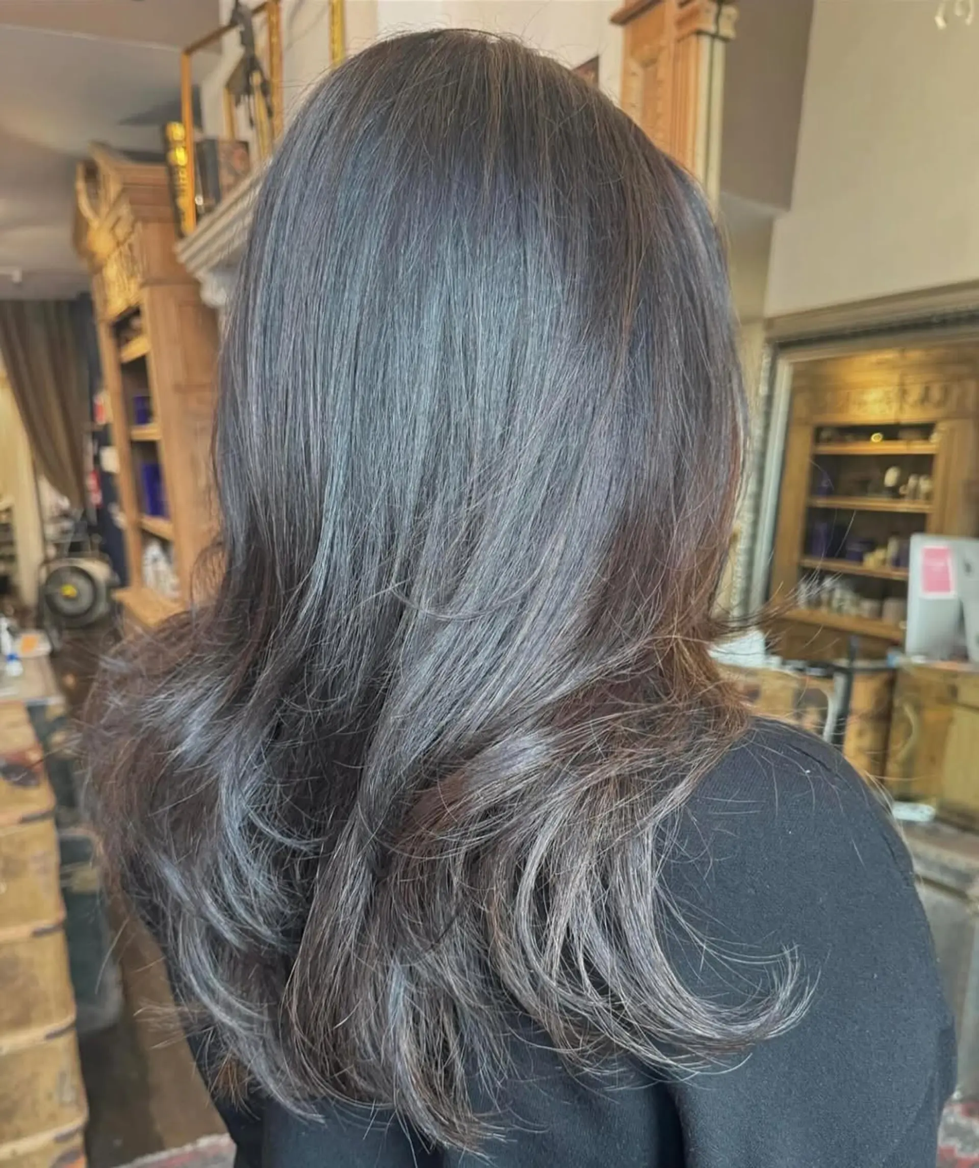 Luxurious long, wavy black hair with soft waves, natural sheen, and layered ends for elegant movement. 2