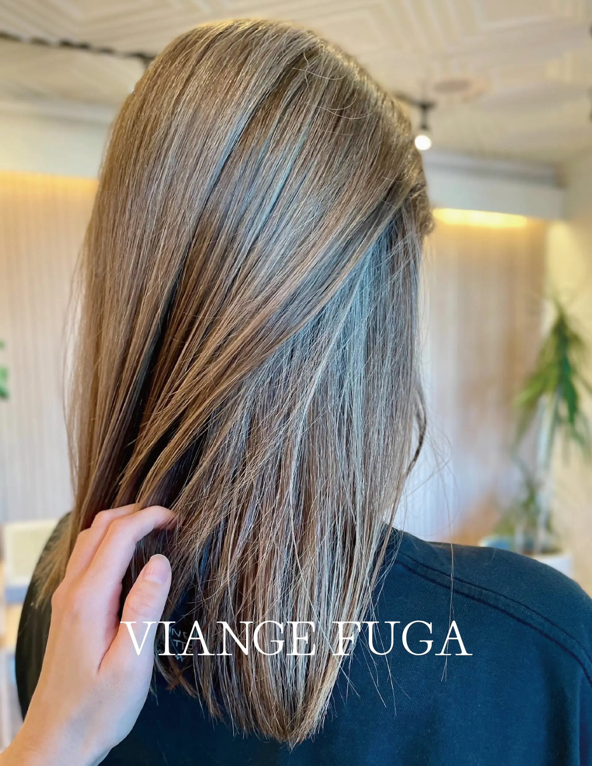 Straight medium-length hair enhanced with fine, multi-dimensional ash blonde and cool brown highlights. 1