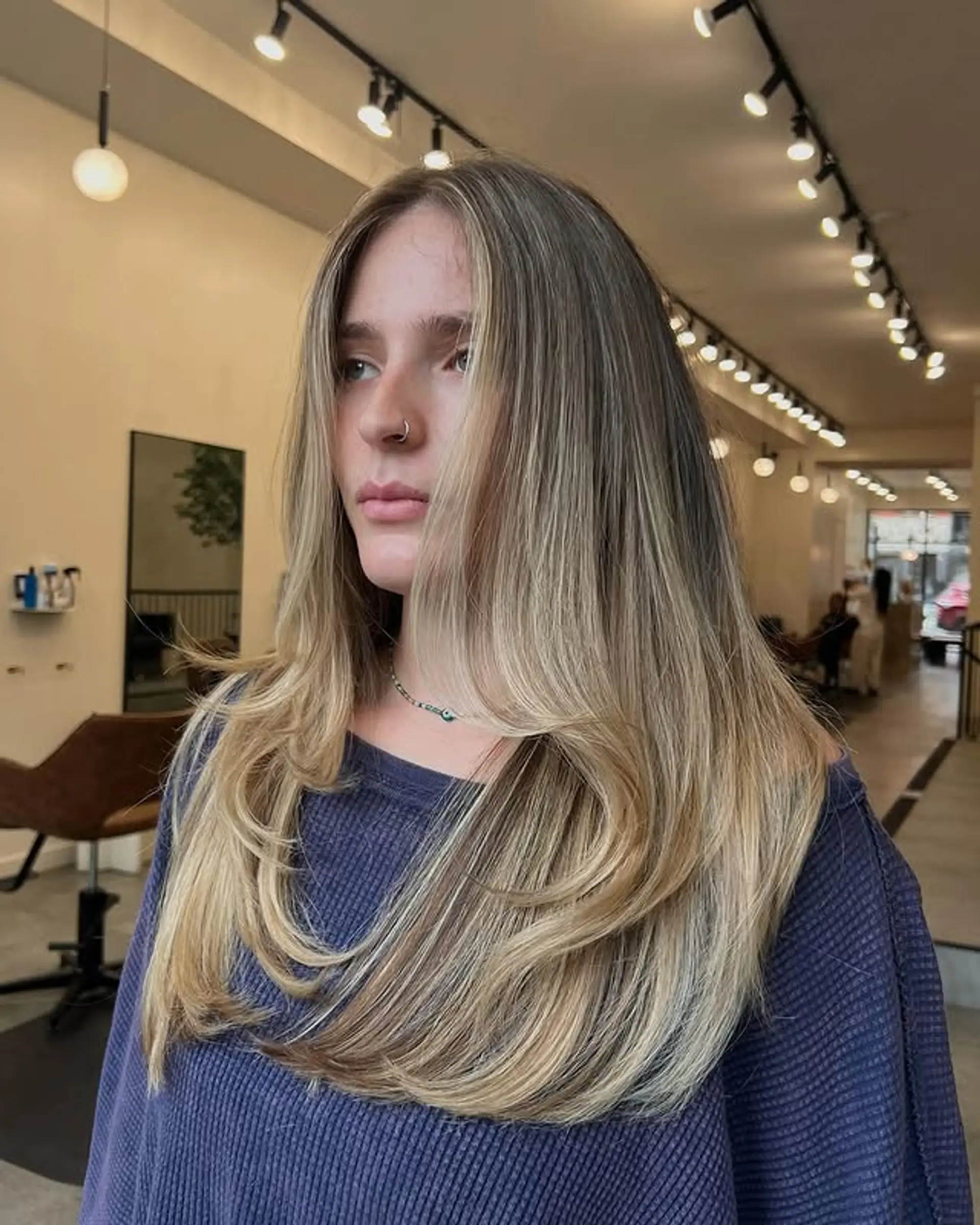 A long, layered cut with face-framing layers that adds dimension and movement. 1