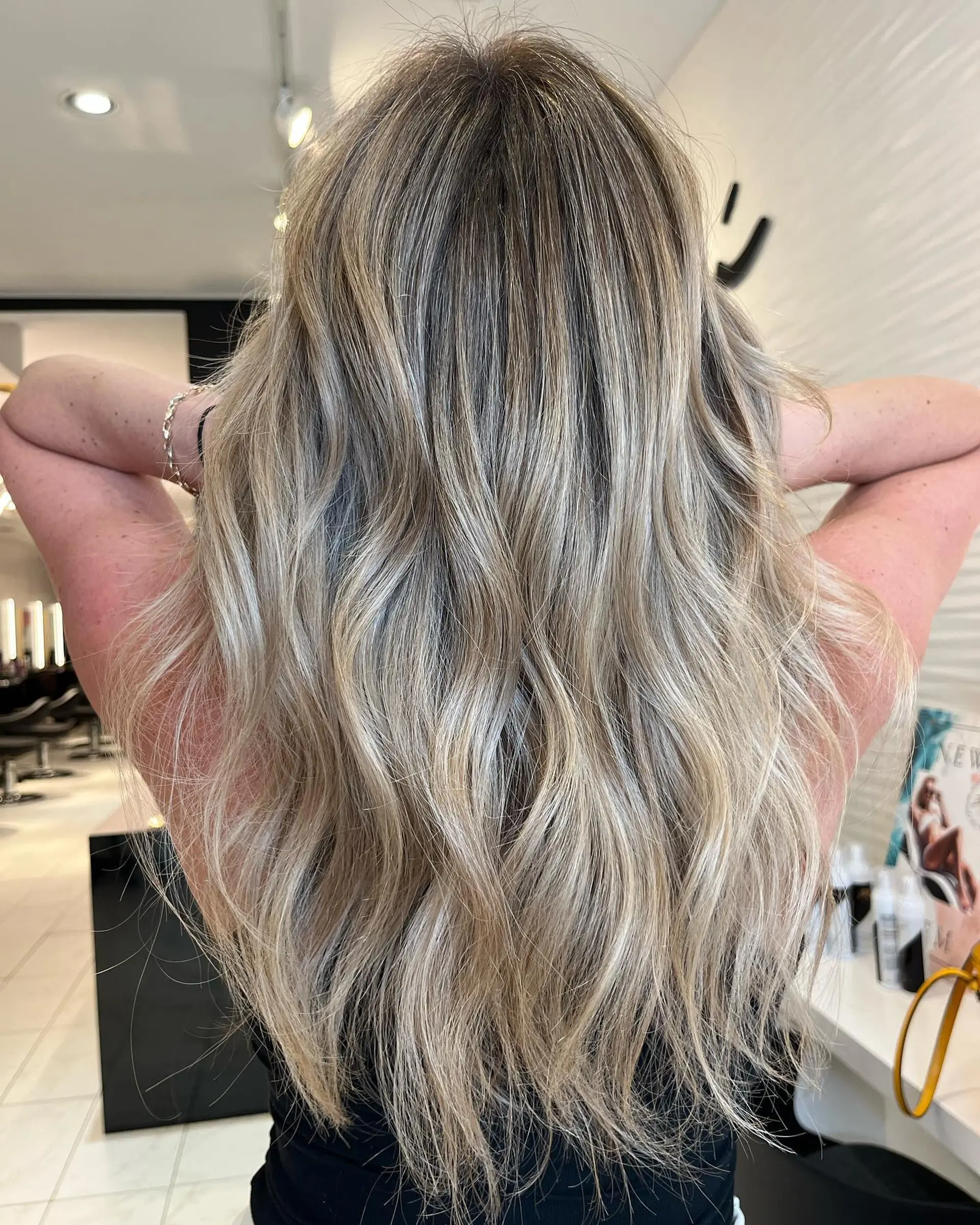 Long, wavy hair with a soft ash blonde balayage. 1
