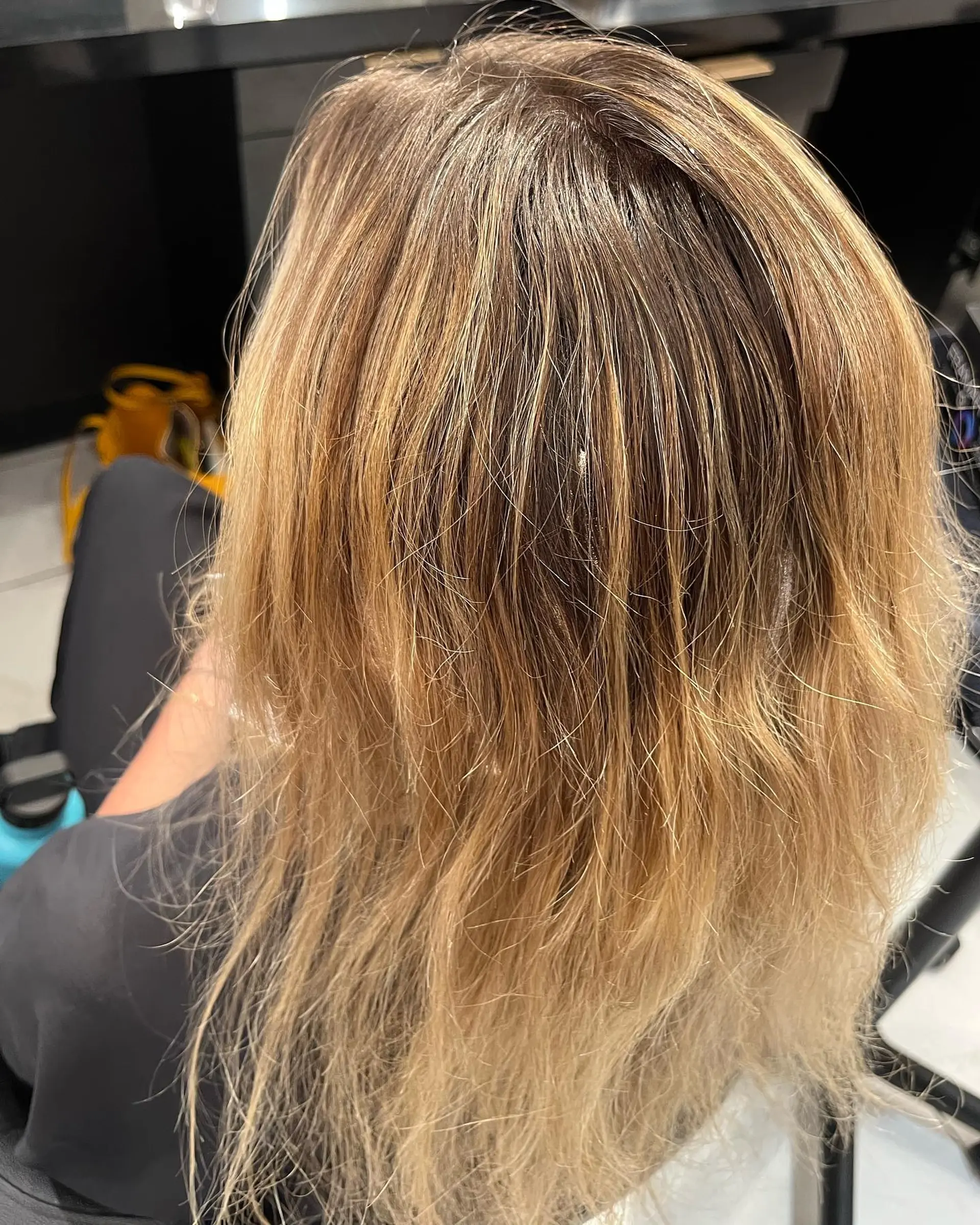 Long, wavy hair with a soft ash blonde balayage. 2