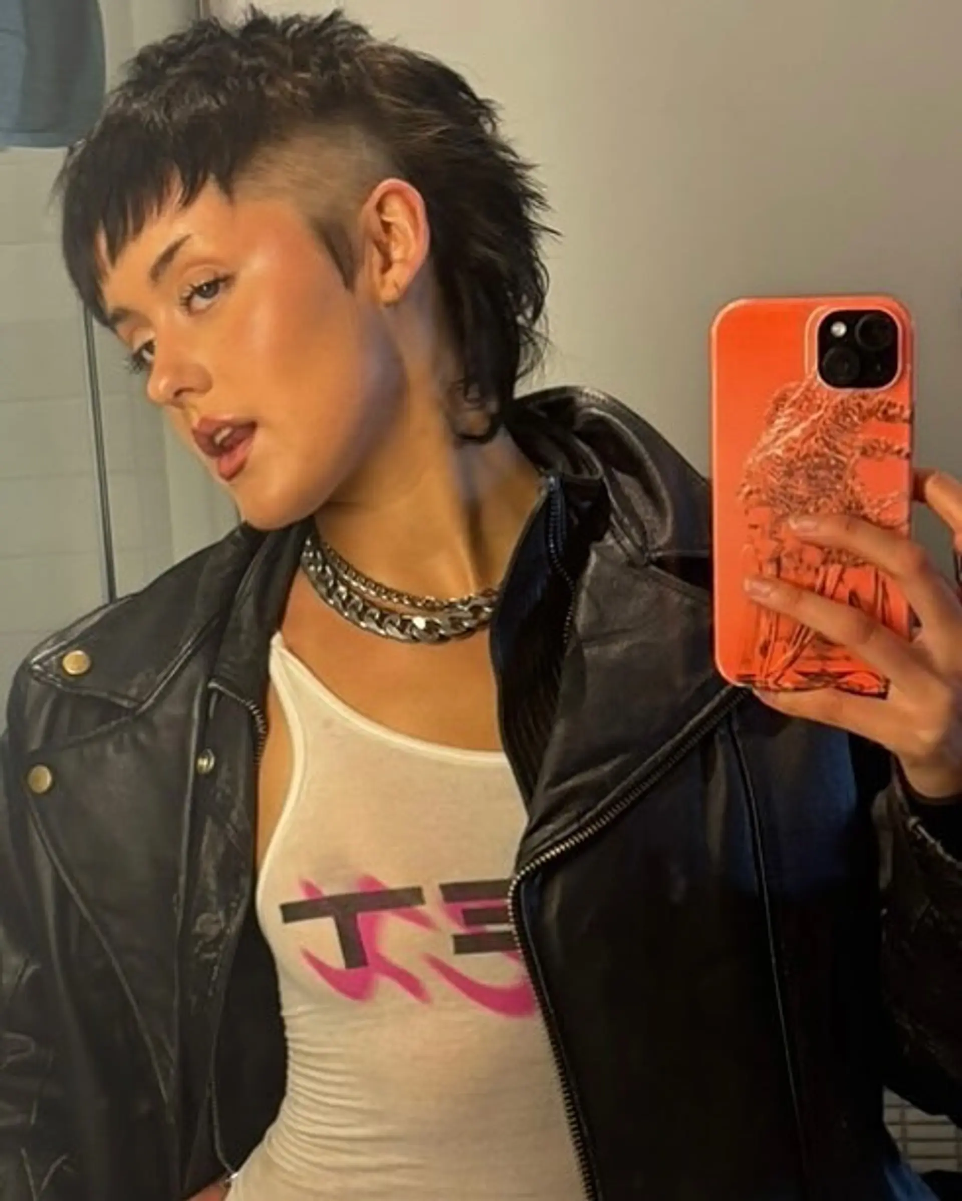 A modern mullet with an undercut, featuring textured layers and a choppy fringe, finished with a sleek yet rebellious style. 1