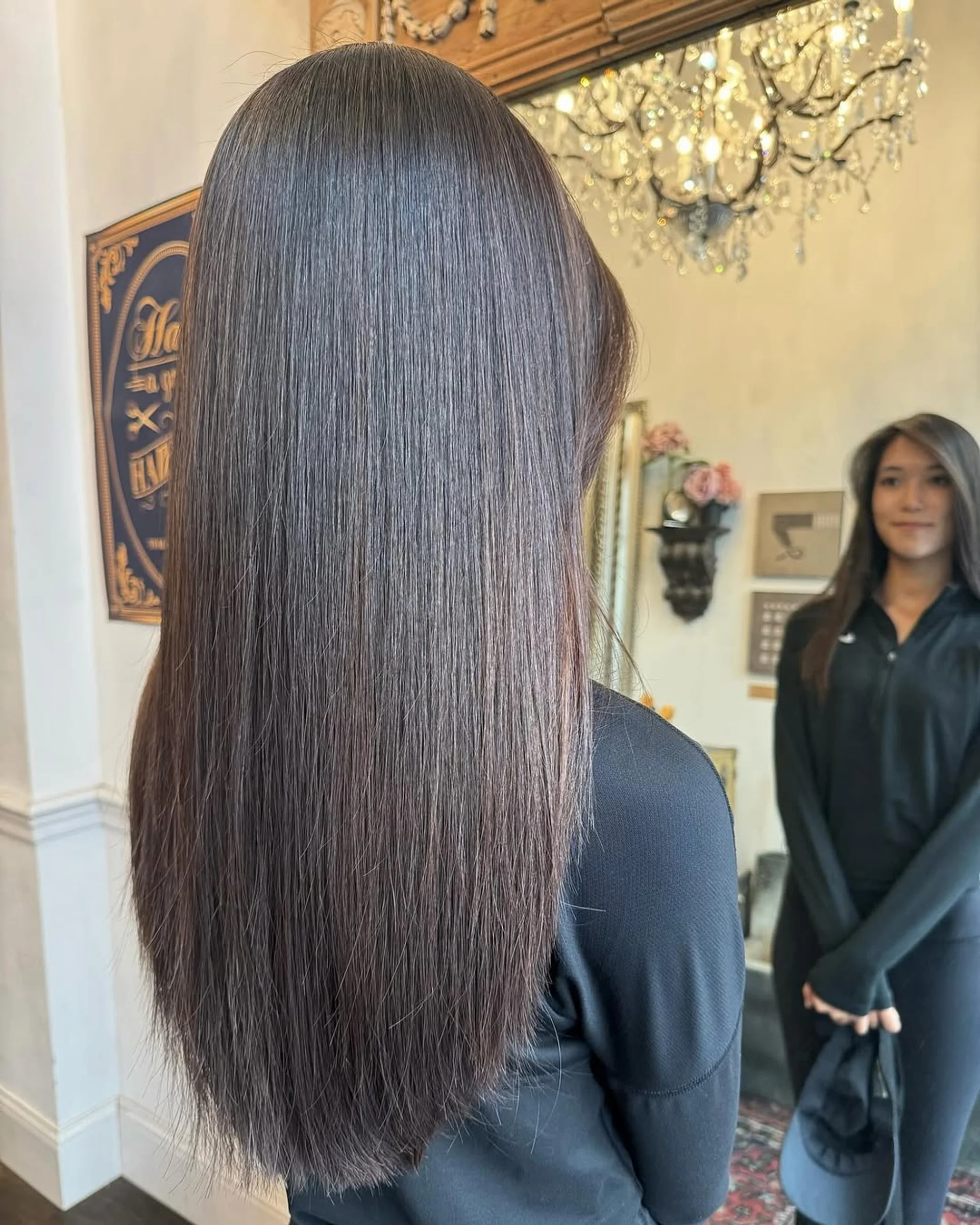 A woman with very long, straight, glossy dark brown hair, representing the 2025 Liquid Hair 2.0 trend. - Preview 2