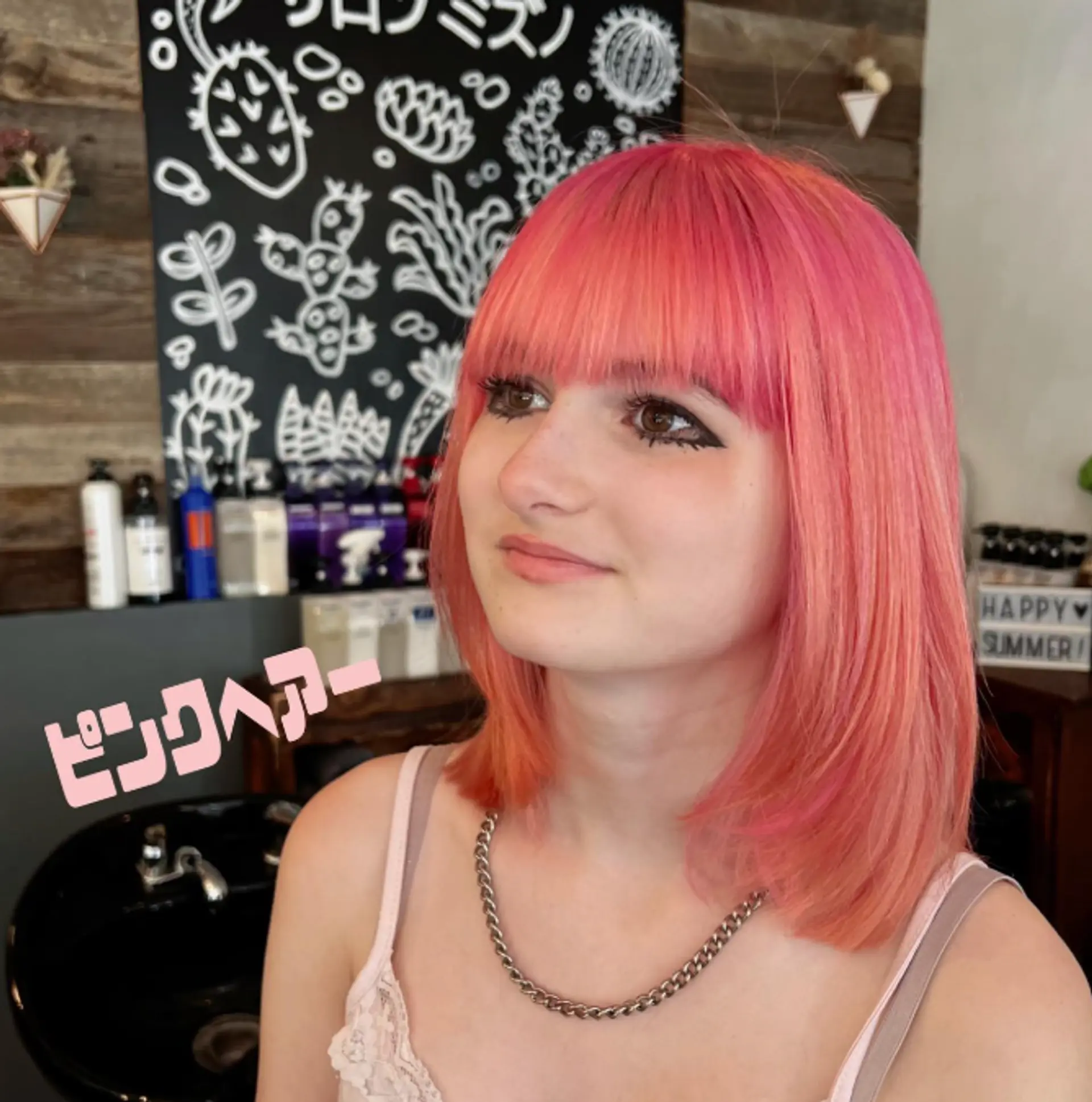 A trendy, medium-length blunt bob with blunt bangs. 1