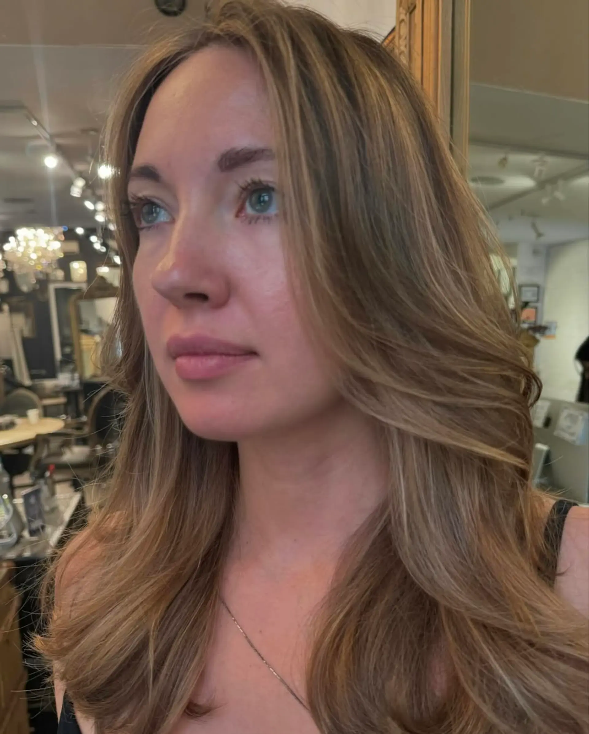 Long, straight hair with golden blonde and honey hues, featuring layered ends for a natural flow. 2