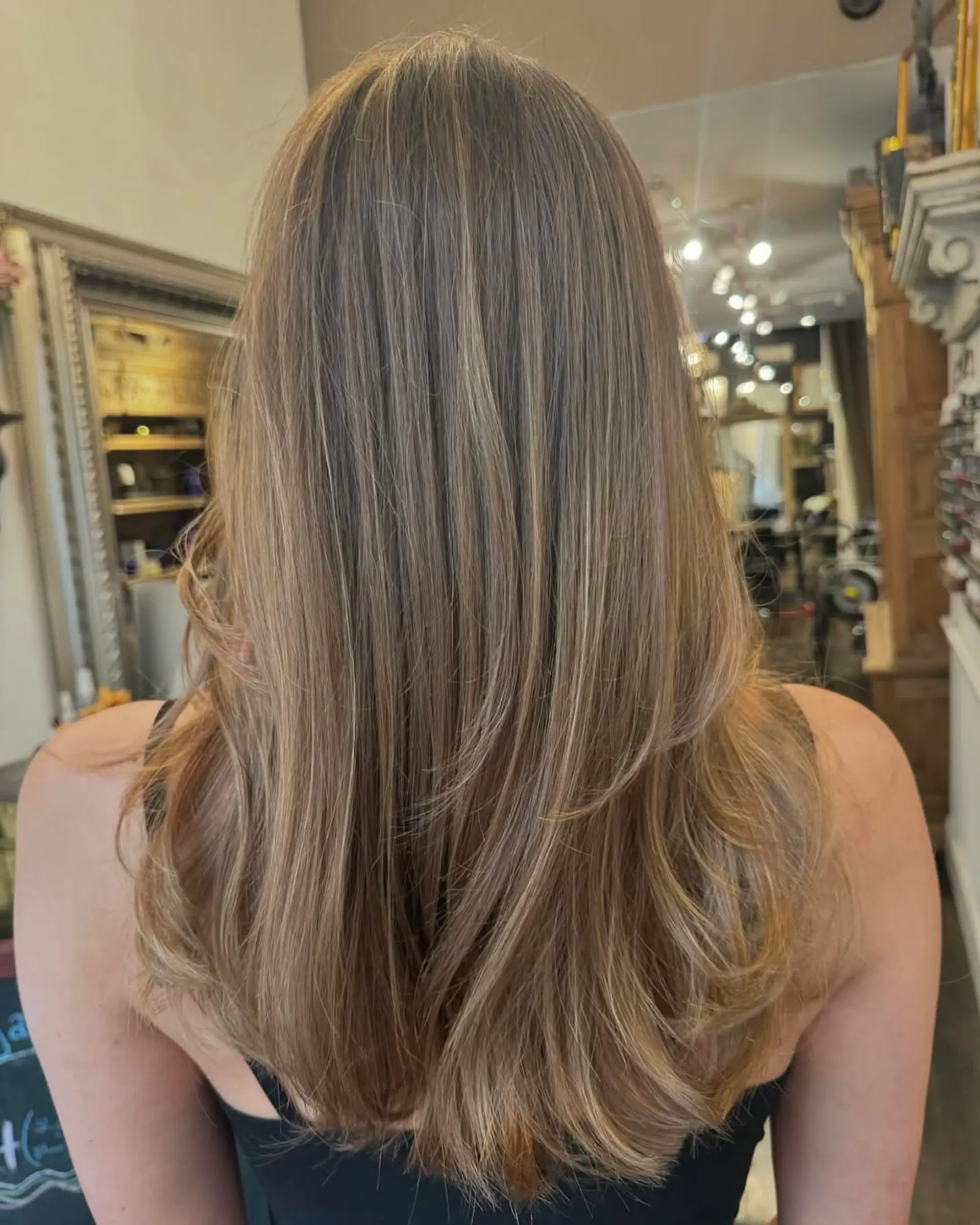 Long, straight hair with golden blonde and honey hues, featuring layered ends for a natural flow. 3