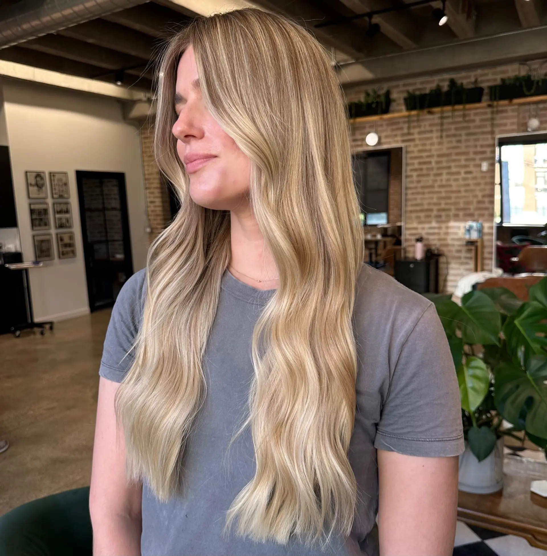 Long, textured waves with a blonde balayage. 1
