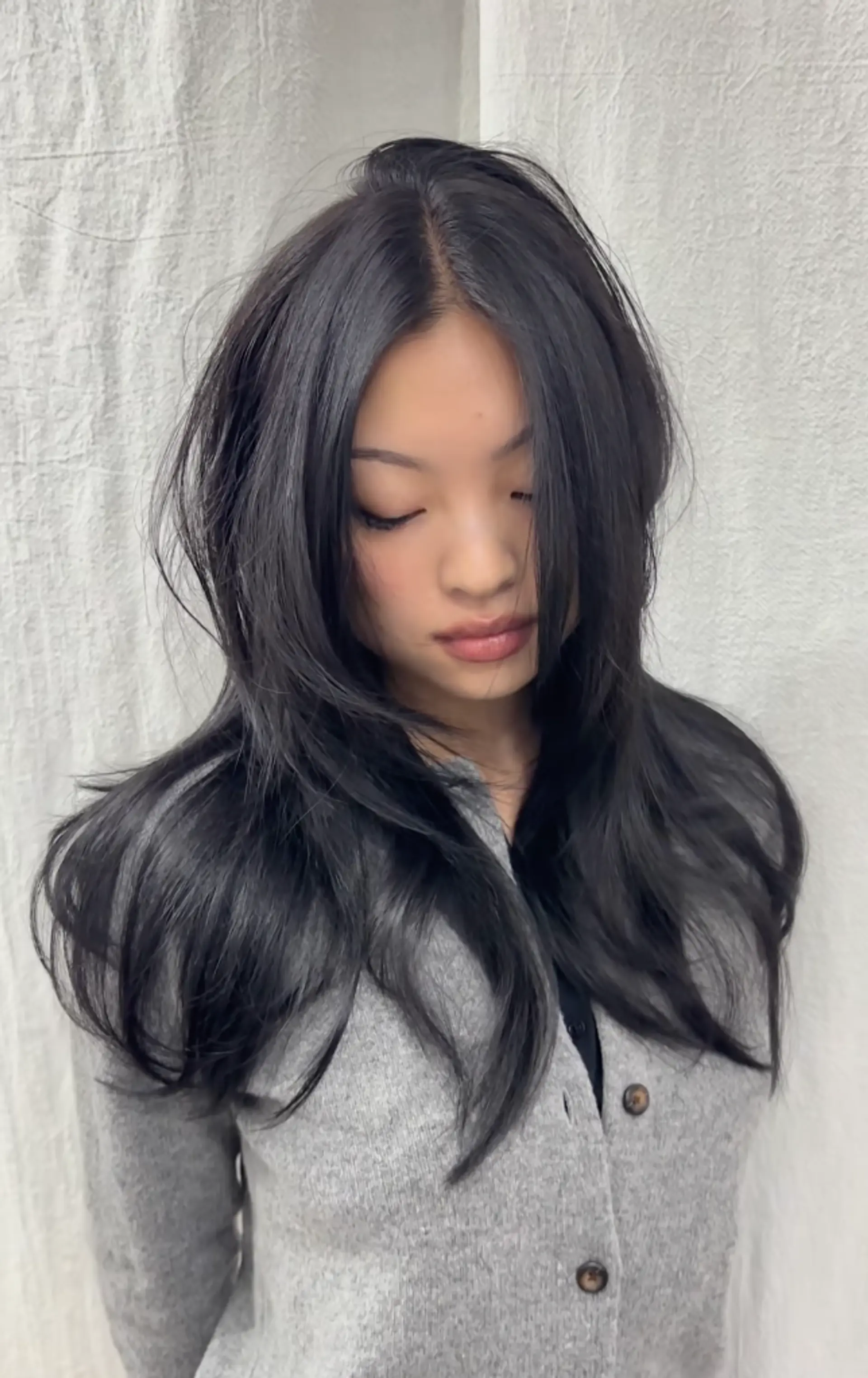 Long, straight black hair with face-framing layers and a side part, featuring a glossy finish. 1