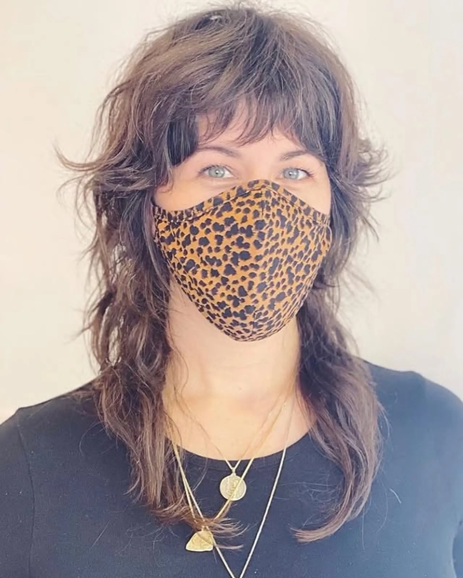 A modern shag with choppy, textured layers and short baby bangs. 1