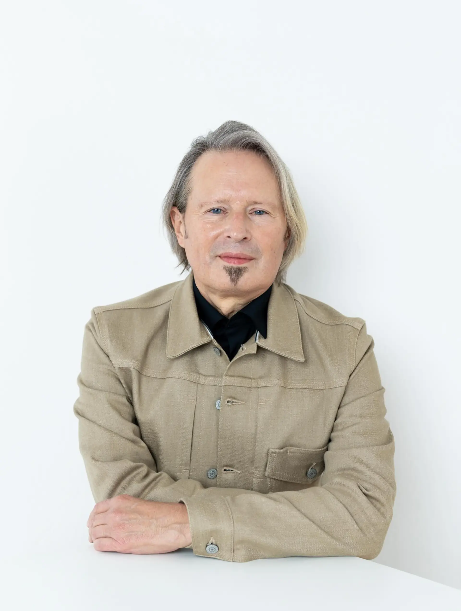A casual, chin-length cut styled with an off-center part and tucked behind one ear, featuring natural straight texture with subtle soft layers. 1