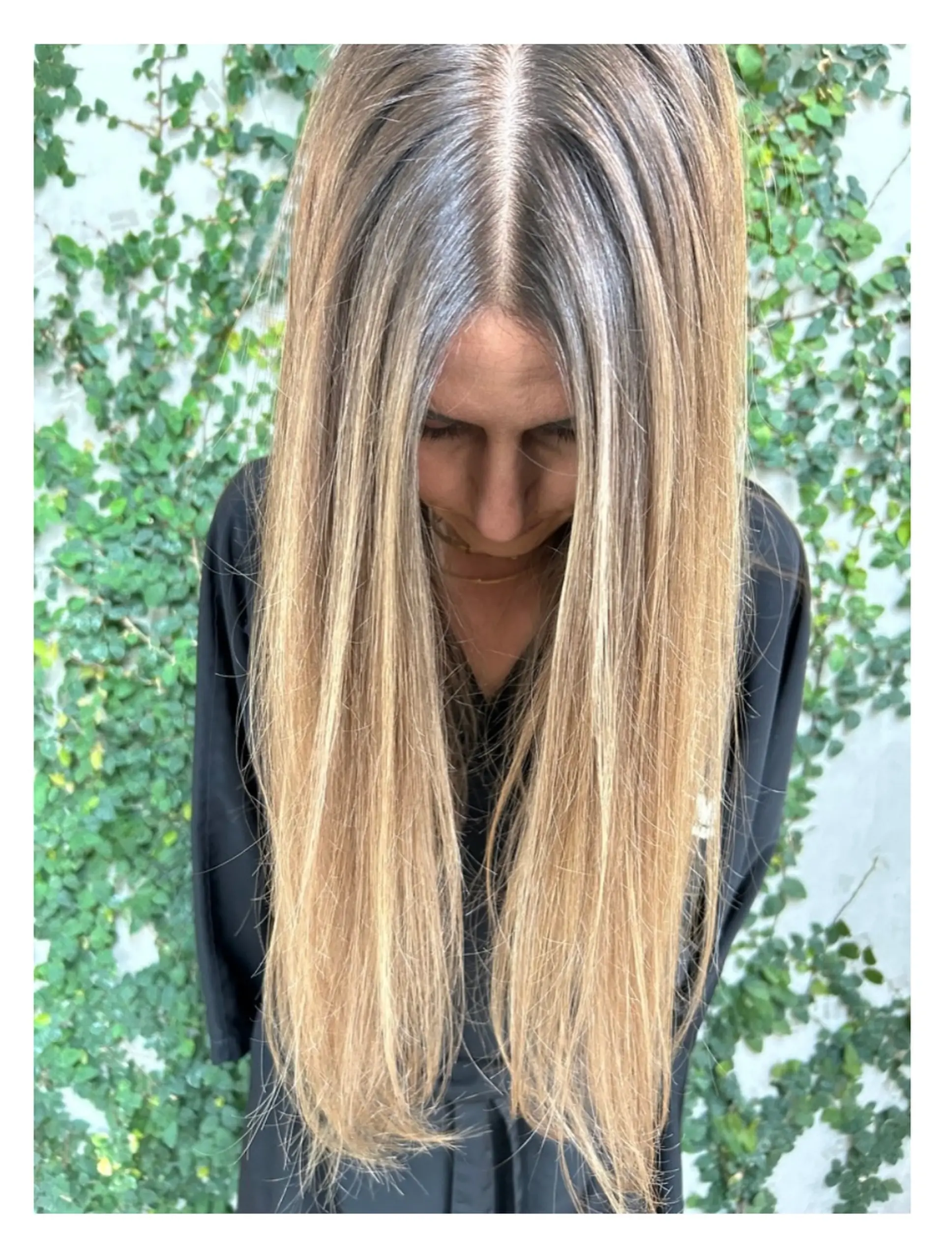 Extra long, sleek straight hair featuring dimensional blonde balayage and highlights starting from a natural root. 1