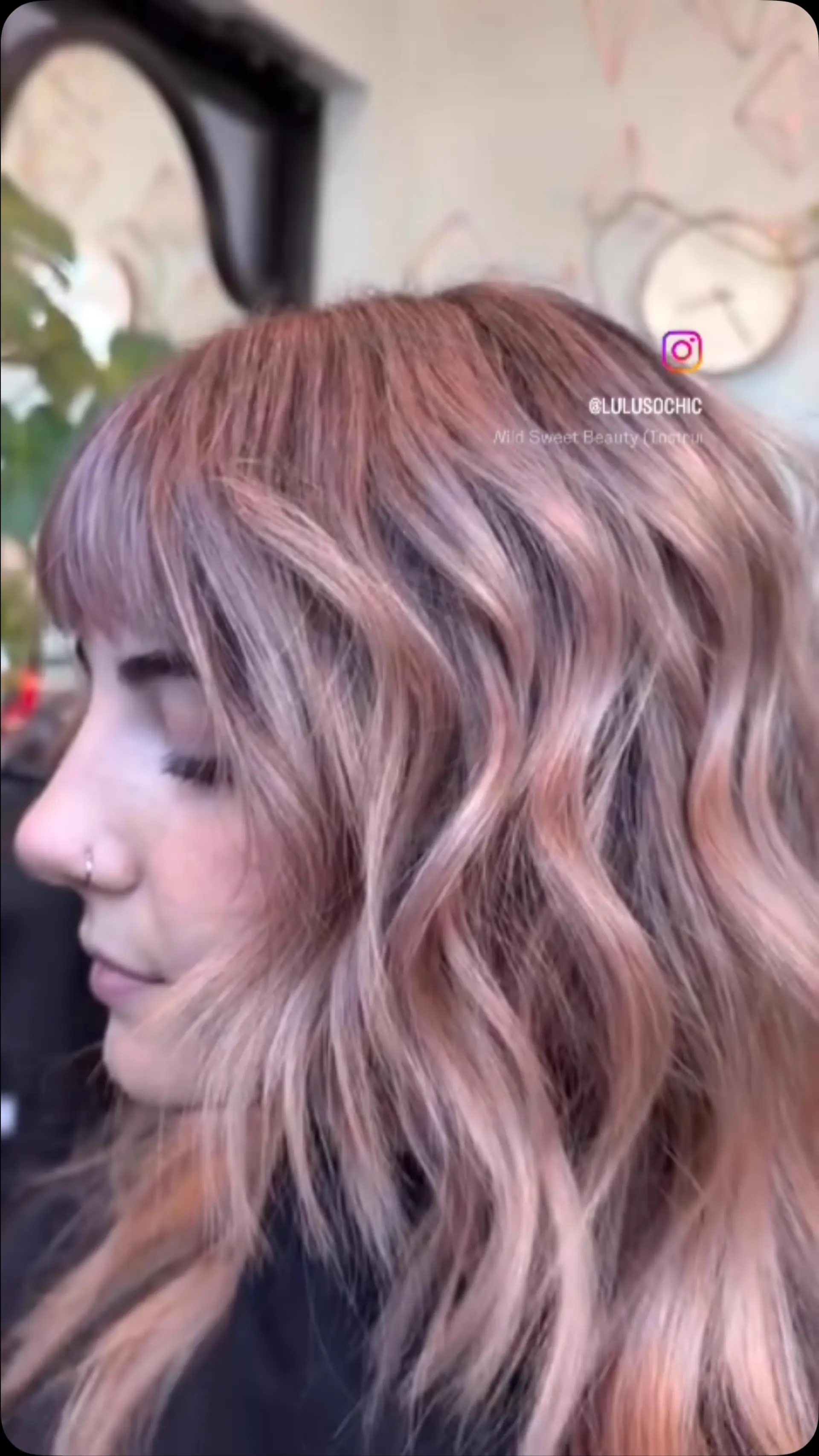 Loose textured waves in a dimensional champagne pink hue, finished with straight bangs. 1