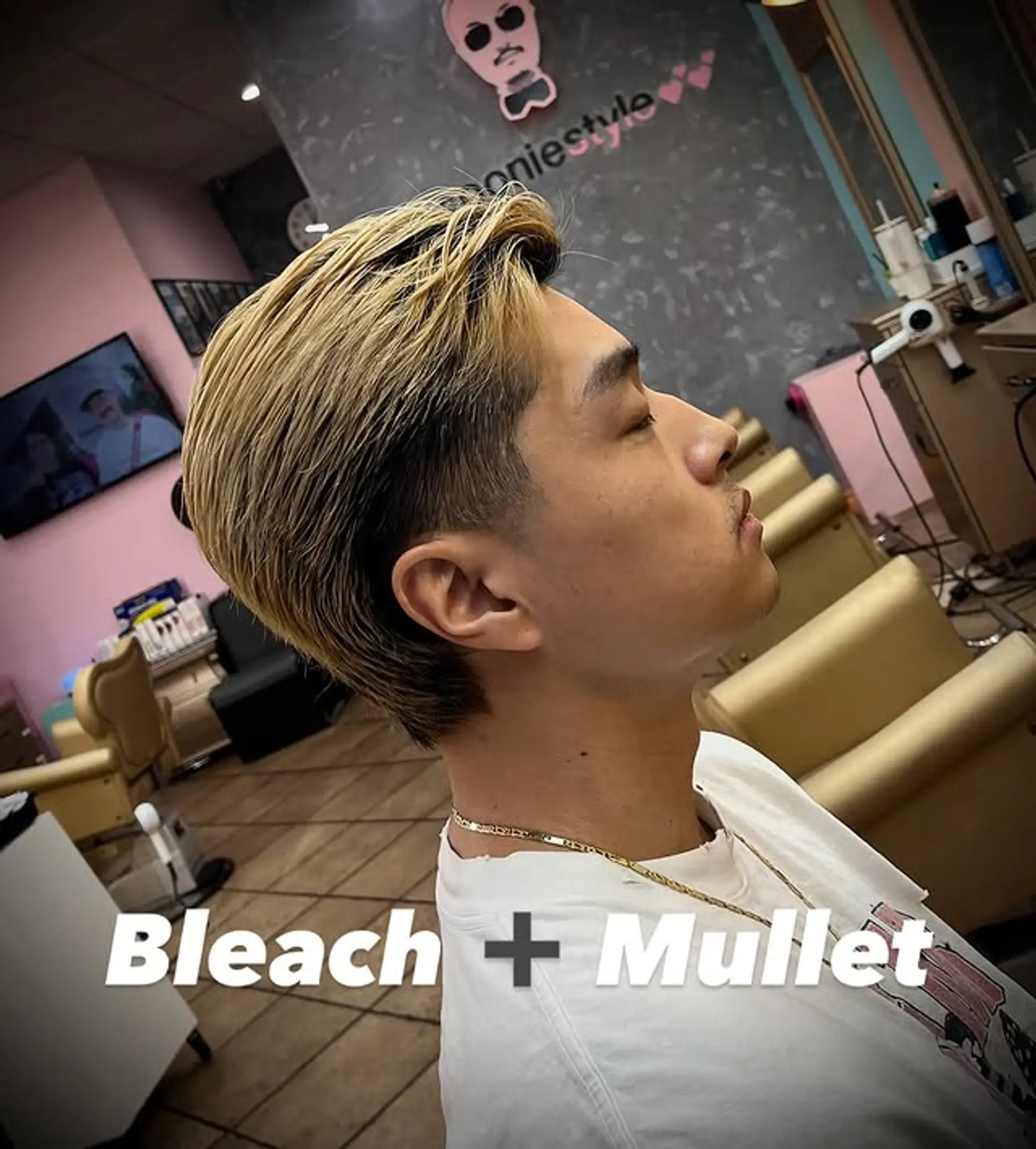 A modern mullet with a bleached top and a subtle undercut. 1
