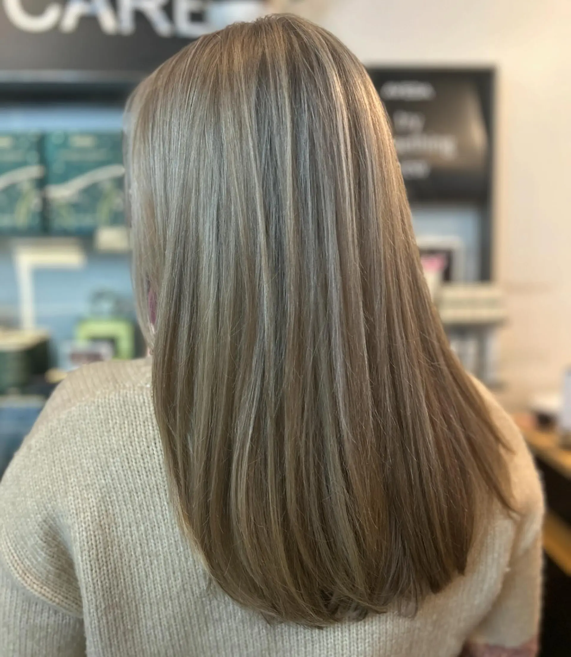 Straight, long hair featuring seamless ash blonde highlights and soft interior layering. 1