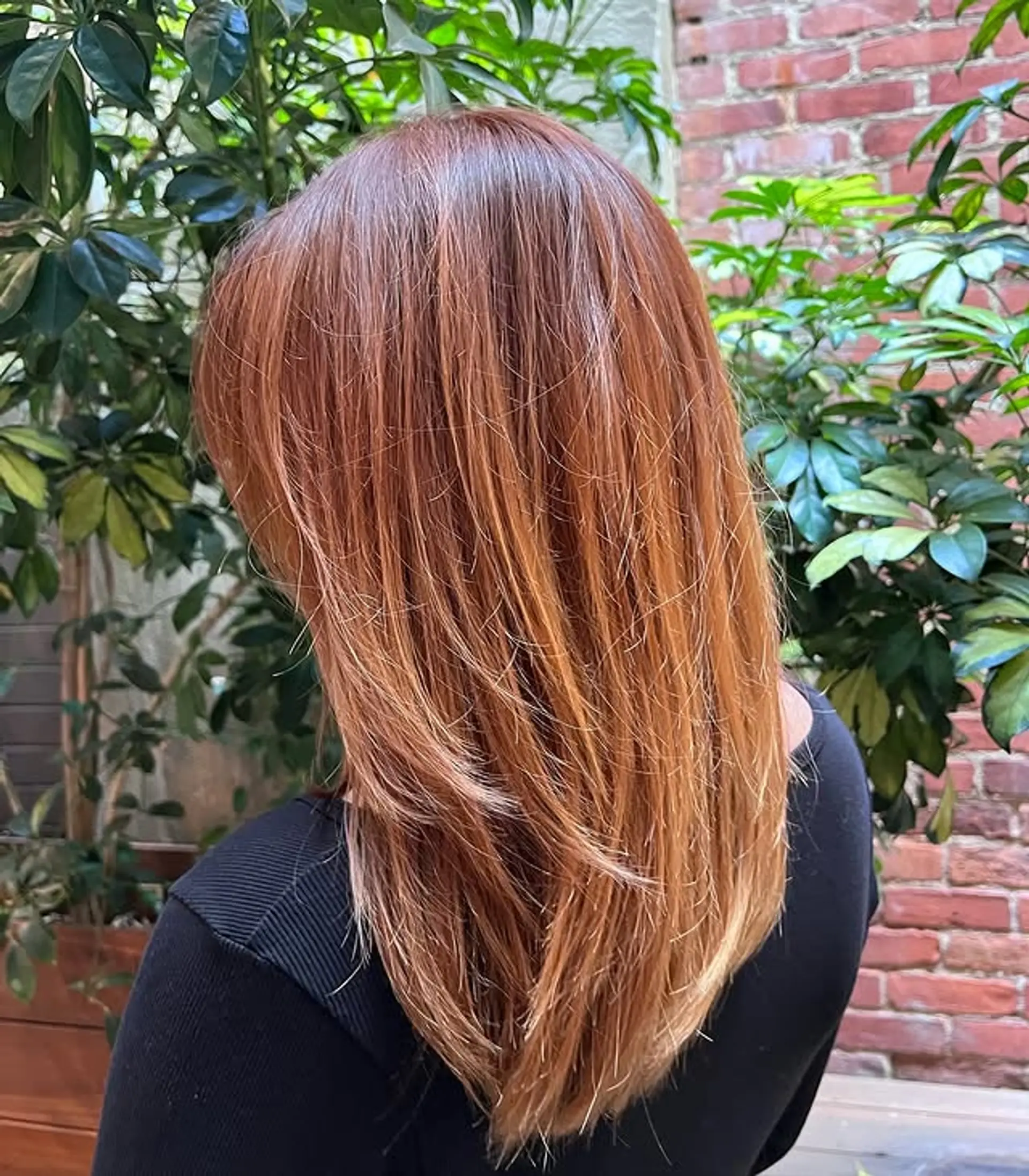 Long layered haircut with ombre color. 1