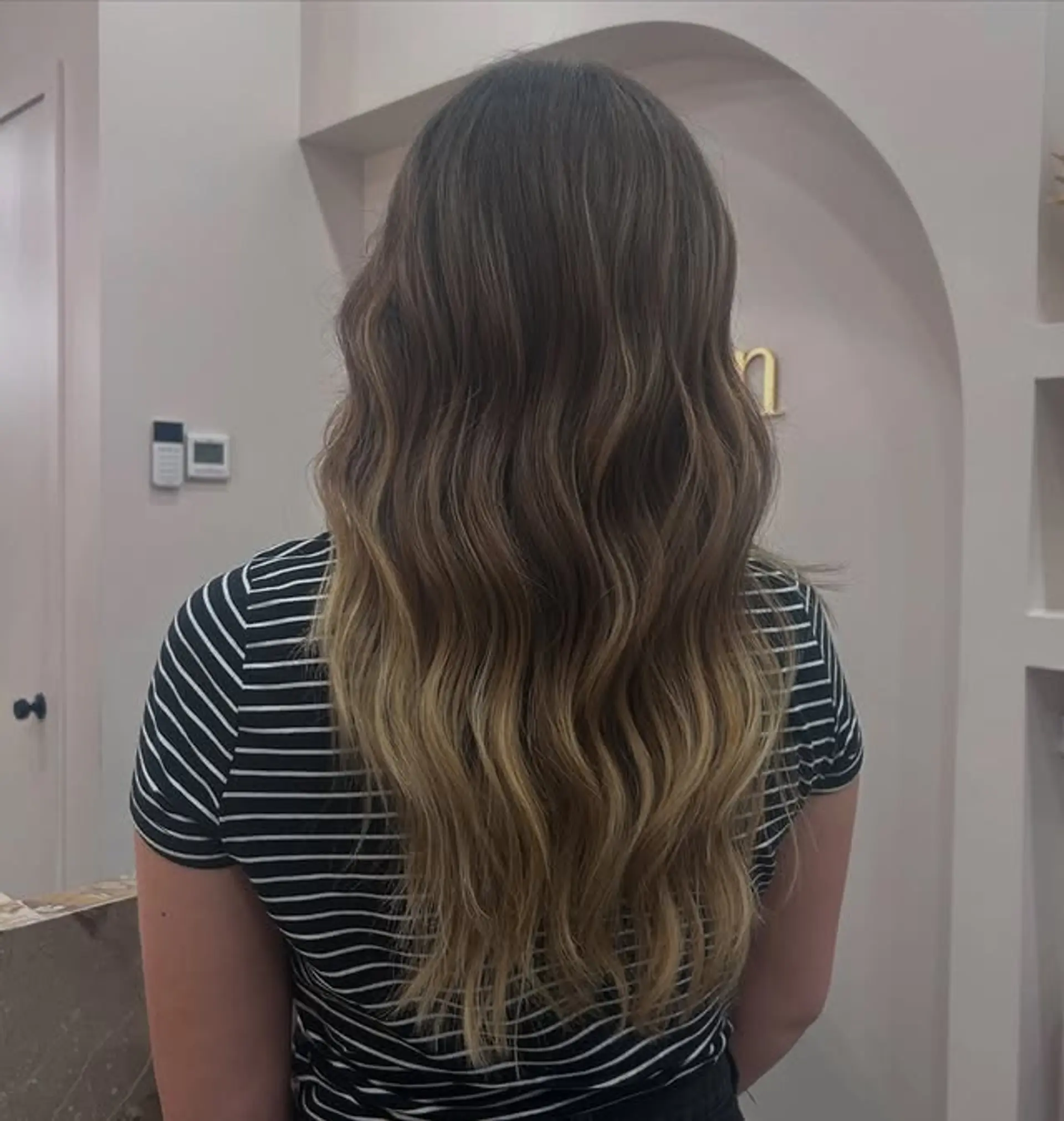 Long, wavy bronde balayage with a seamless color transition. 1