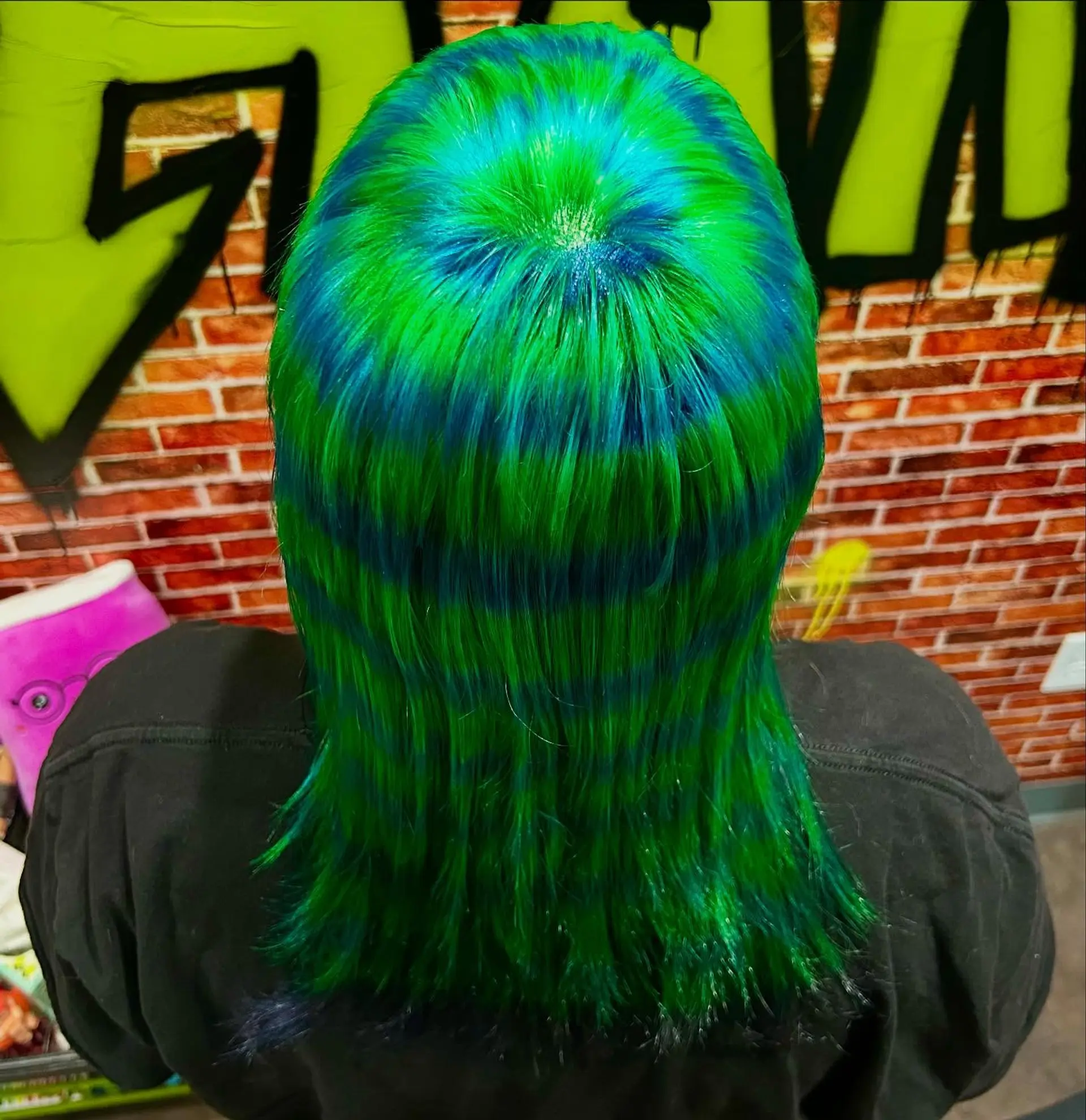 Concentric spiral dye pattern radiating from the crown in alternating horizontal bands of vivid neon green and electric blue. 1