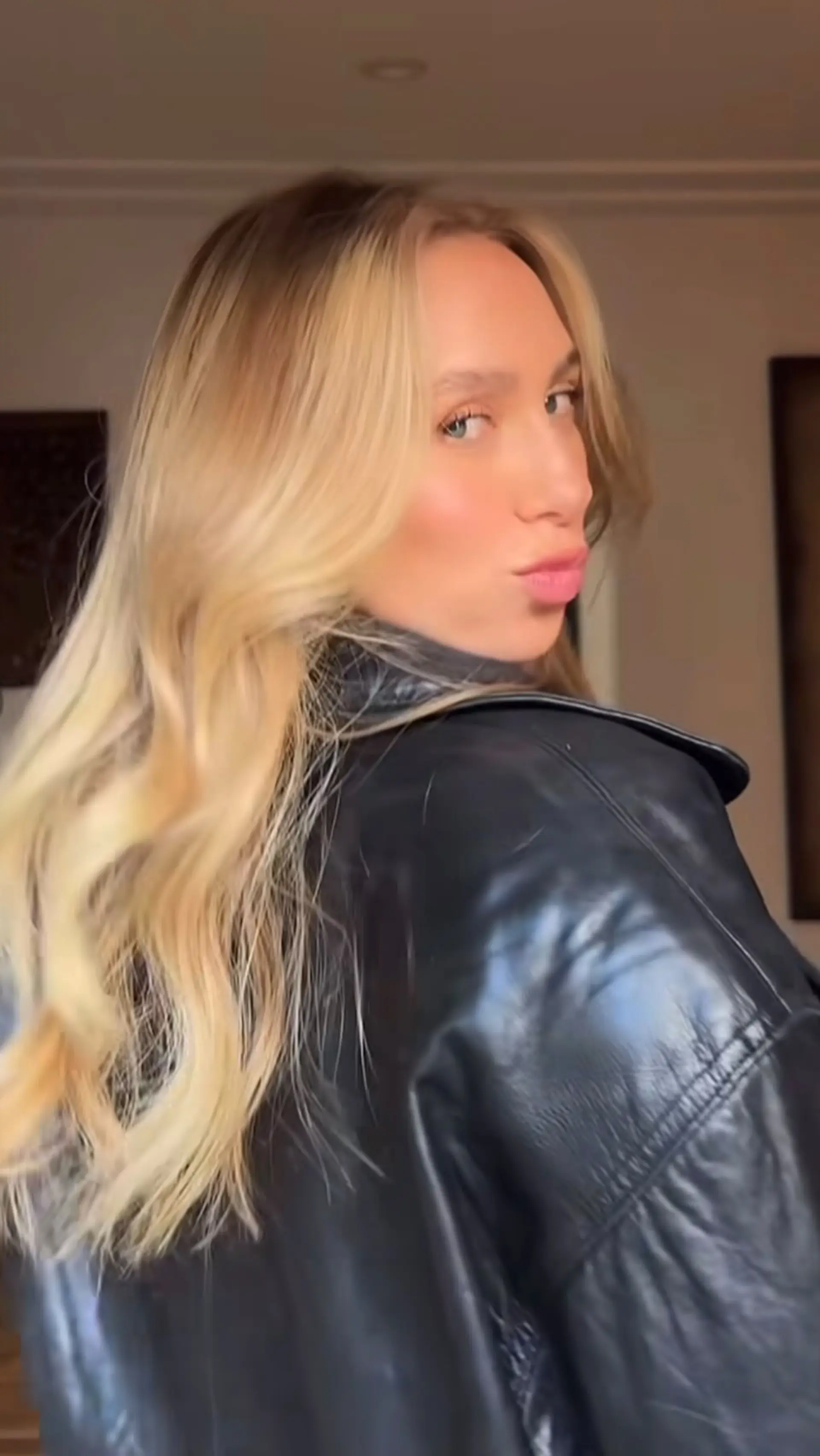 Long warm golden blonde hair styled in soft, cascading waves. 1